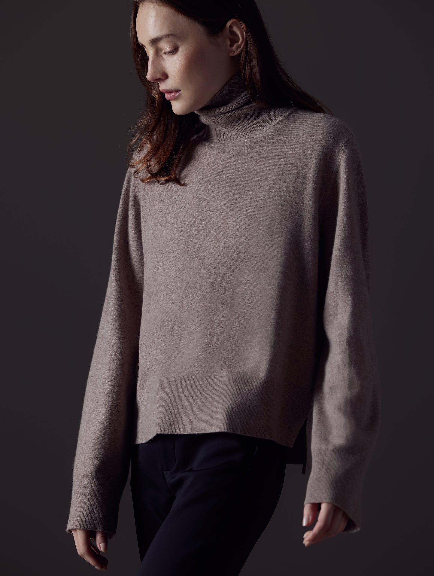 Front view of woman wearing Leigh Cashmere Turtleneck Sweater in Toast Brown from AETHER Apparel.