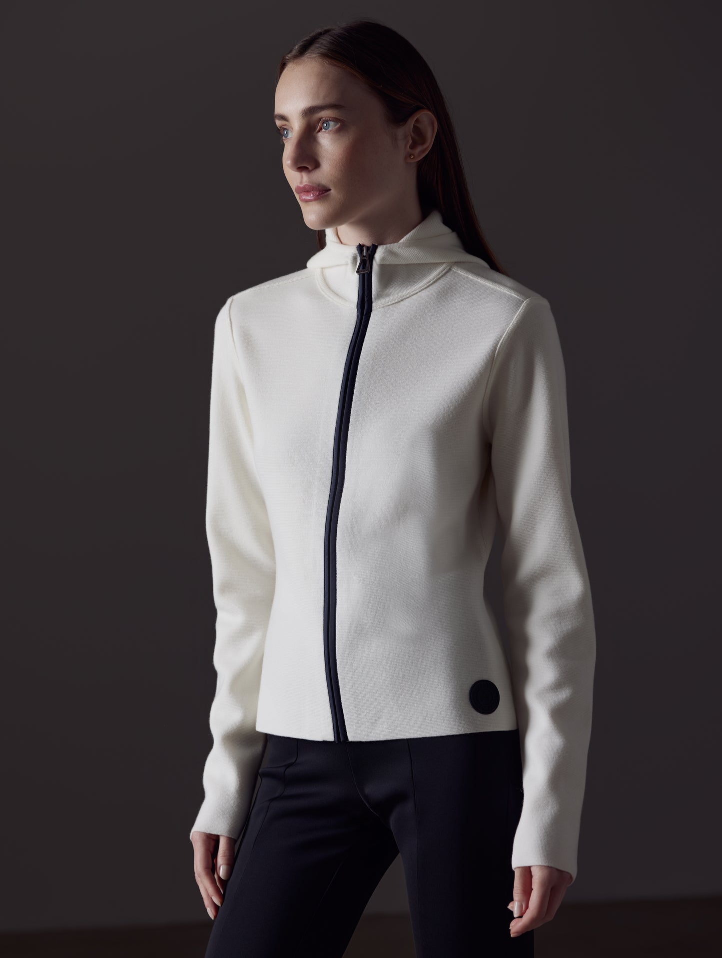 Front angled view of woman wearing Riley Full-Zip Sweater in Winter White from AETHER Apparel.