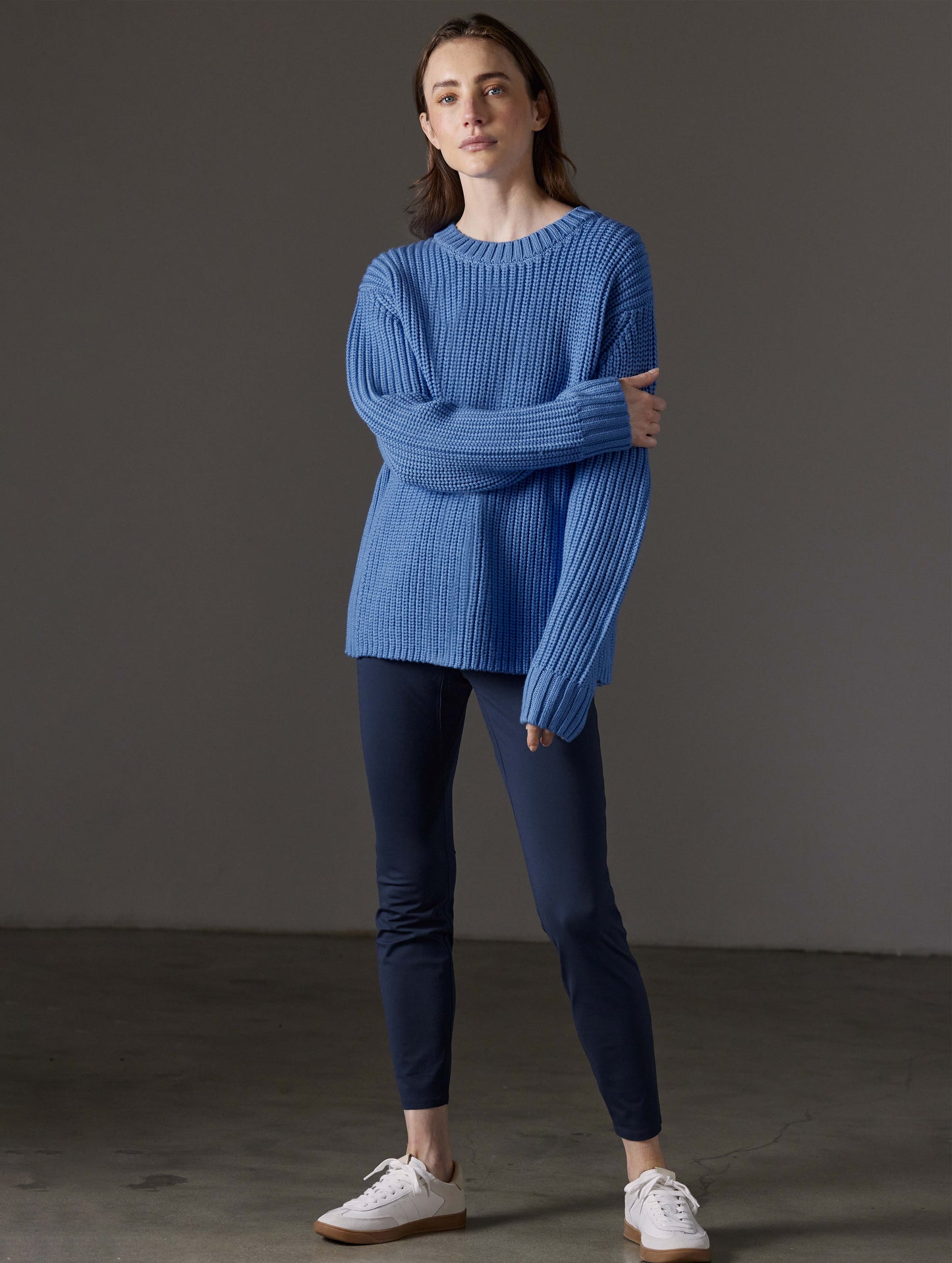 Front full-body view of woman wearing Sherwood Crewneck Sweater in Lavender Blue from AETHER Apparel.