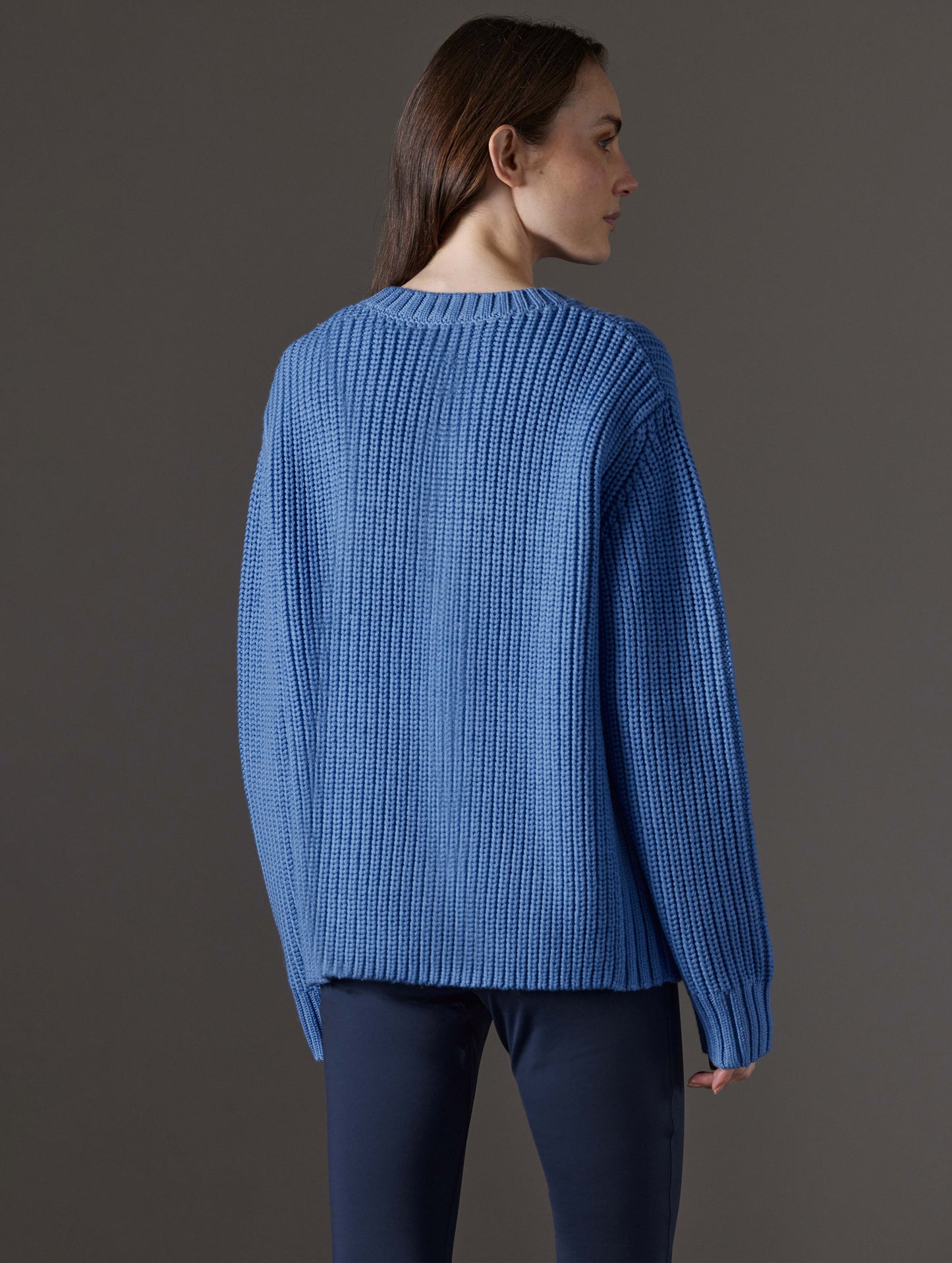 Rear view of woman wearing Sherwood Crewneck Sweater in Lavender Blue from AETHER Apparel.