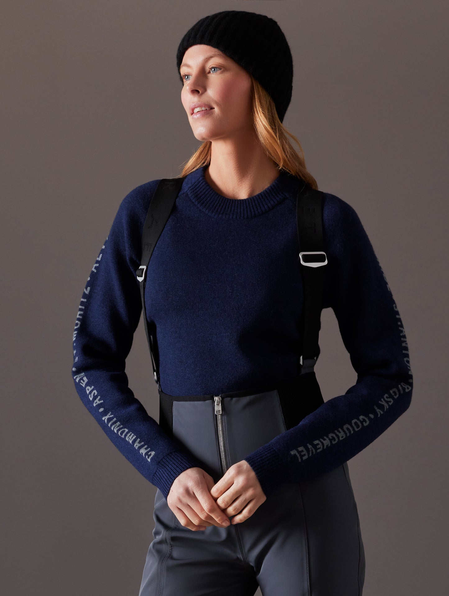 woman wearing dark blue sweater from AETHER Apparel