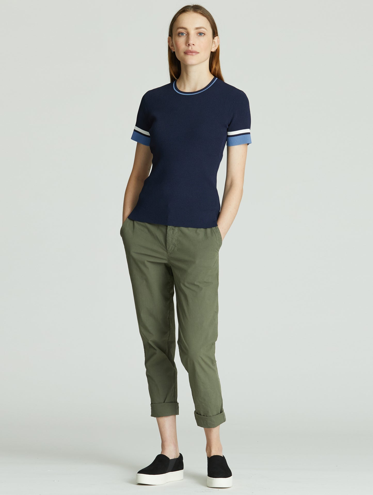 Full-body view of woman wearing blue Short-Sleeve Rib-Knit Crew Sweater from AETHER Apparel.