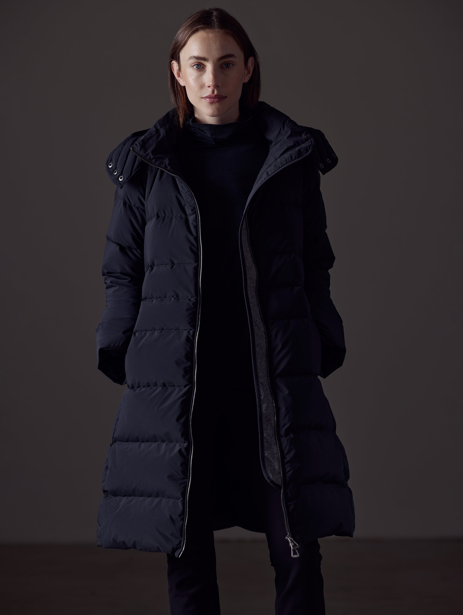 Front view of woman wearing Stirling Jacket in Onyx Black from AETHER Apparel.