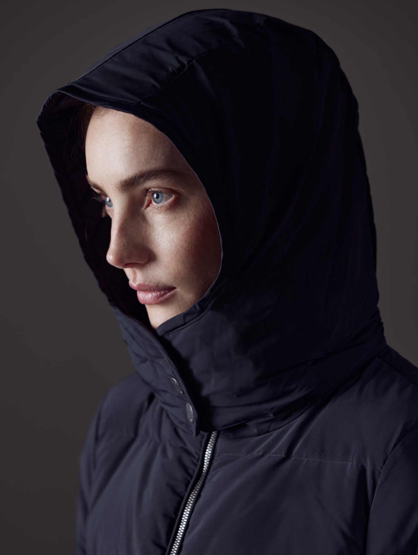 Closeup detailed view of hood on Stirling Jacket in Onyx Black from AETHER Apparel.