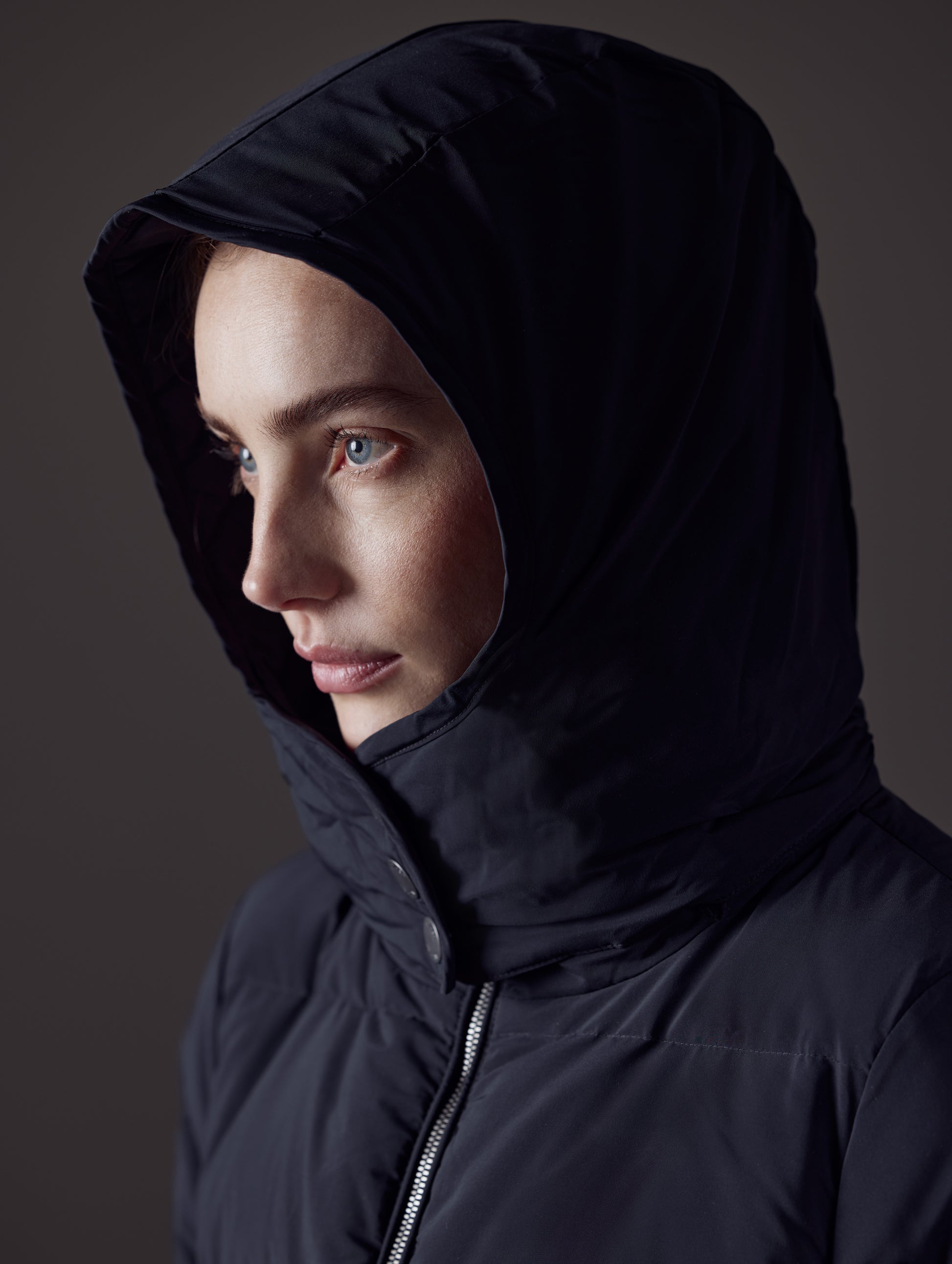 Closeup detailed view of hood on Stirling Jacket in Onyx Black from AETHER Apparel.