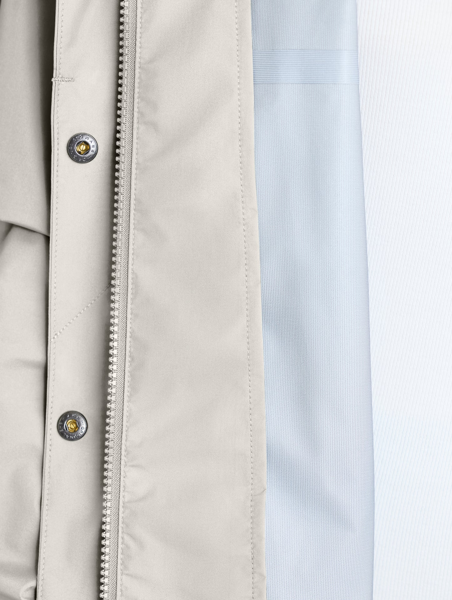 Closeup view of interior left of Storm All-Weather Jacket in Bone white from AETHER Apparel.