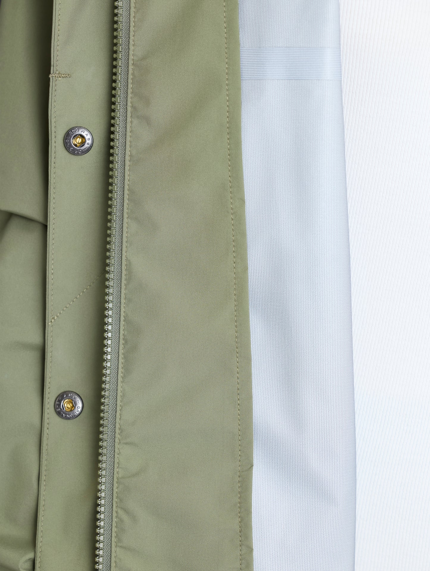 Closeup view of interior left of Storm All-Weather Jacket in Fern Green from AETHER Apparel.