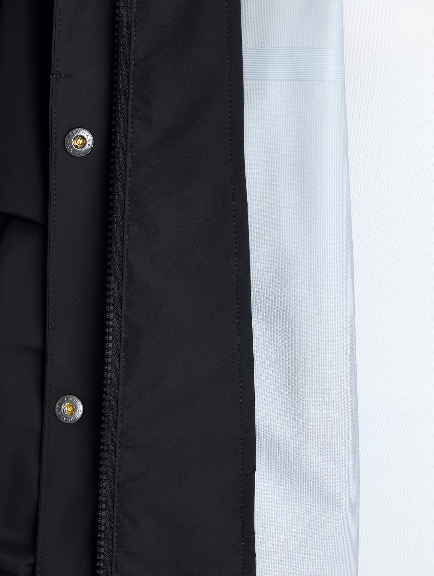 Closeup of left interior of Storm All-Weather Jacket in Onyx Black from AETHER Apparel.