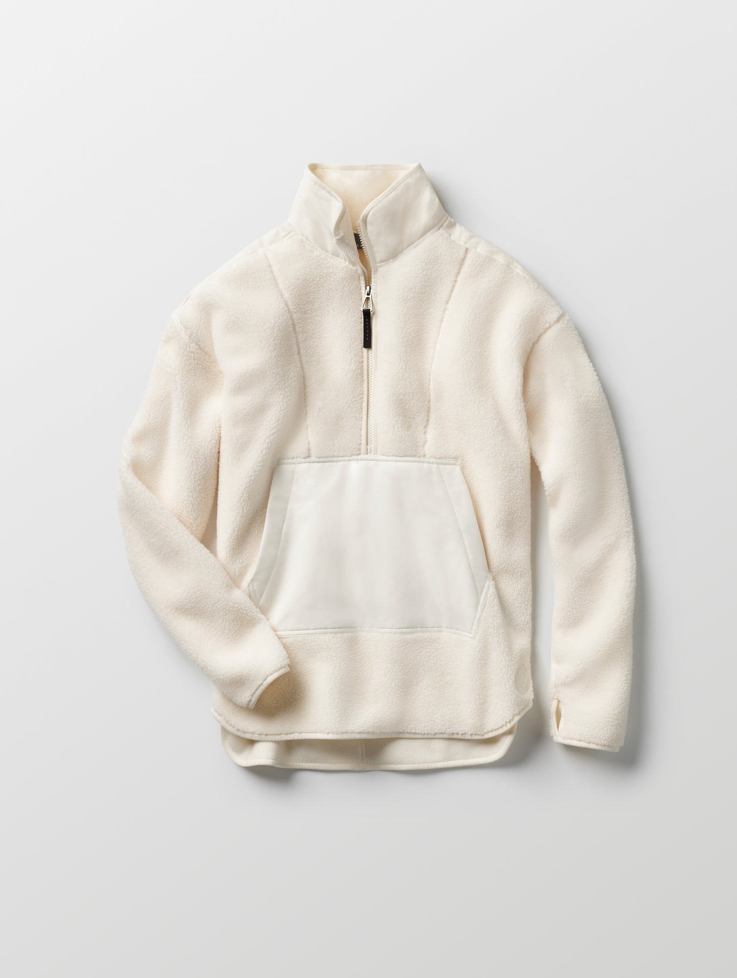 Flat lay of women’s Terrain Fleece Anorak in Winter White from AETHER Apparel.
