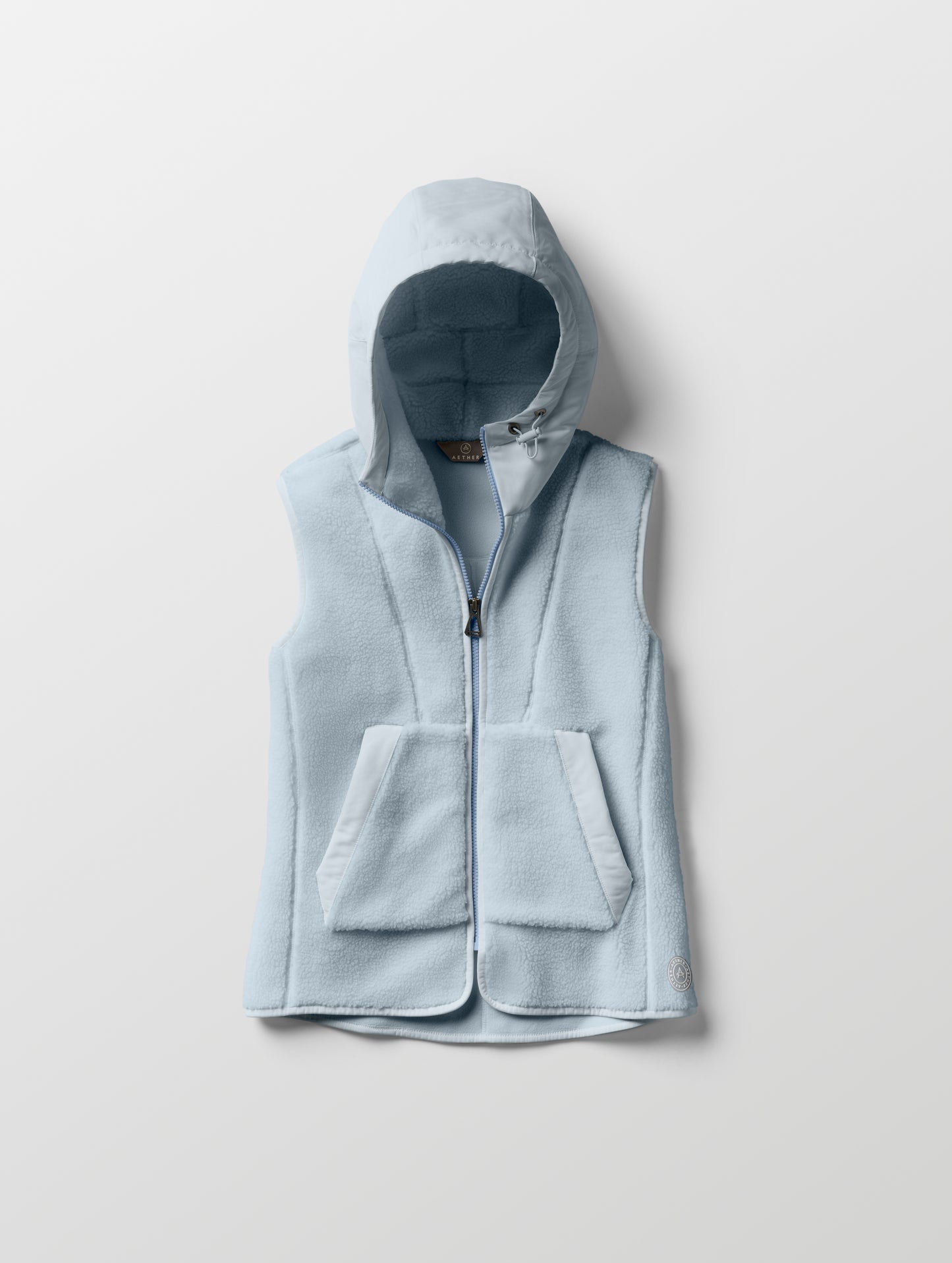 Flat lay of women’s Terrain Fleece Vest in Flight Blue from AETHER Apparel.