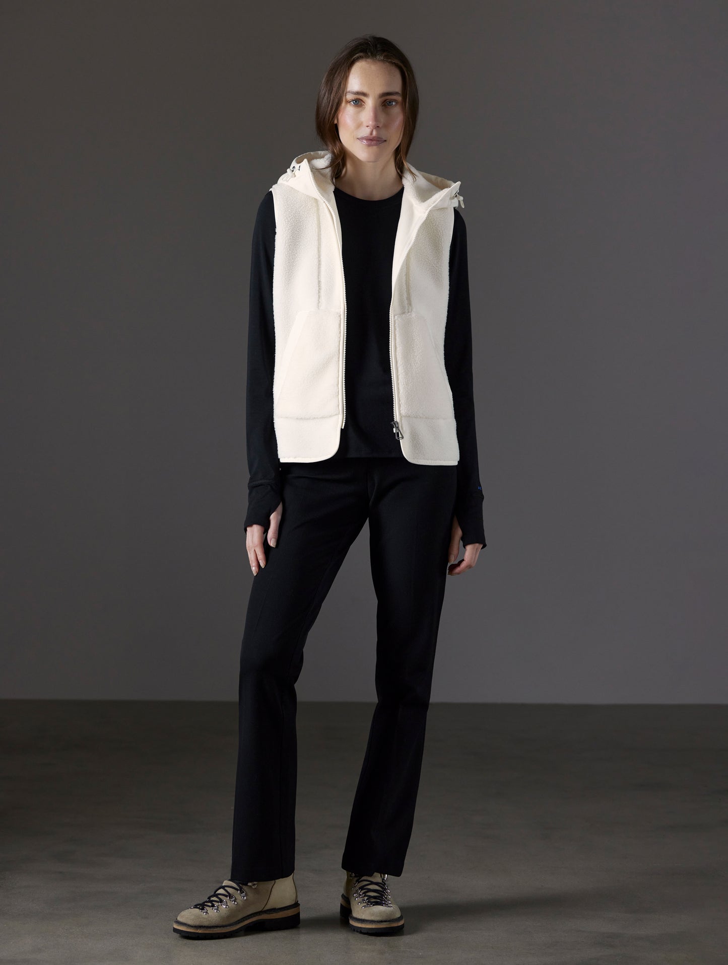 Front full-body view of woman wearing Terrain Fleece Vest in Winter White from AETHER Apparel.