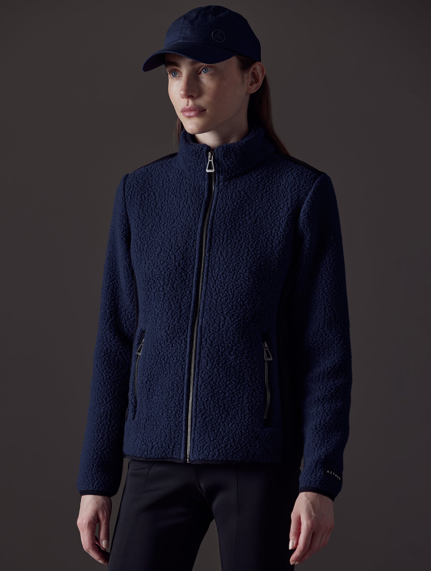 Woman wearing blue fleece from AETHER Apparel