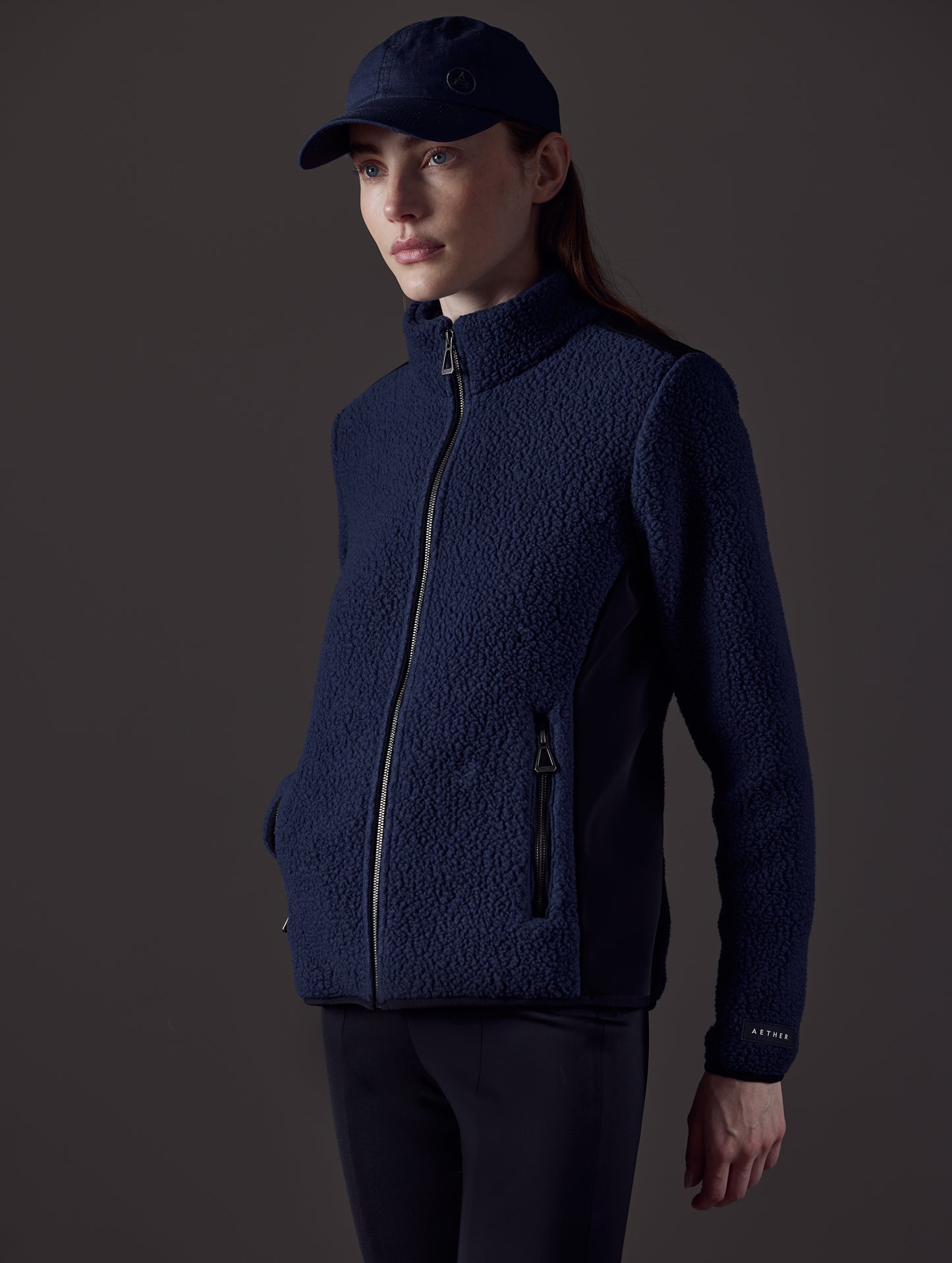 Woman wearing blue fleece from AETHER Apparel