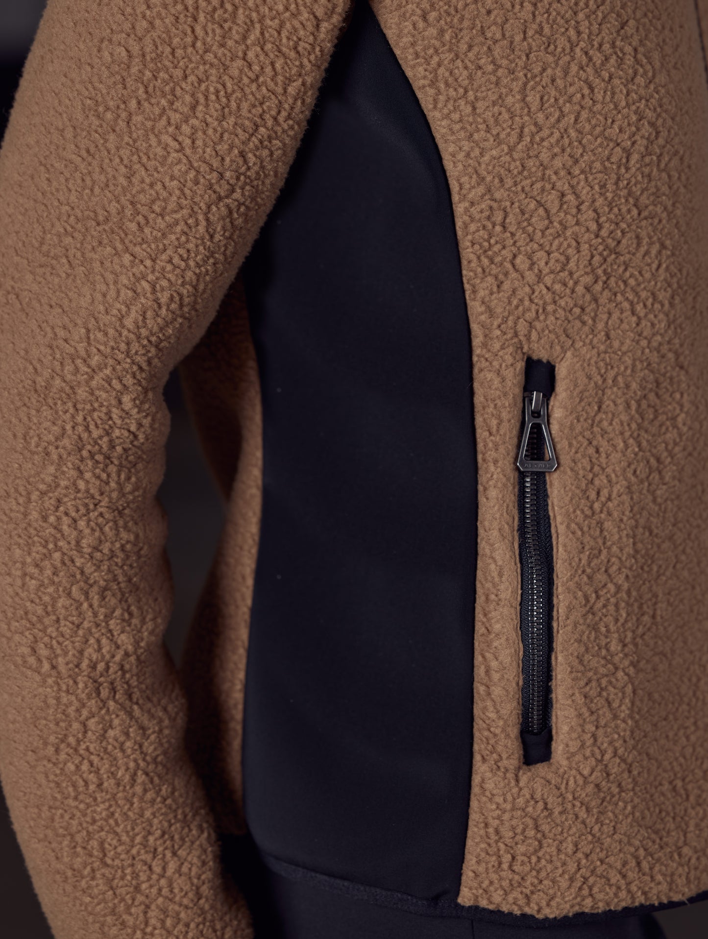 Woman wearing brown fleece from AETHER Apparel