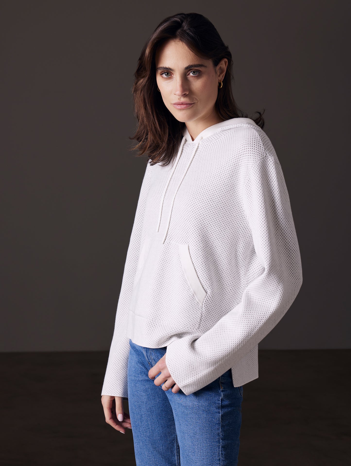 woman wearing beige sweater from AETHER Apparel