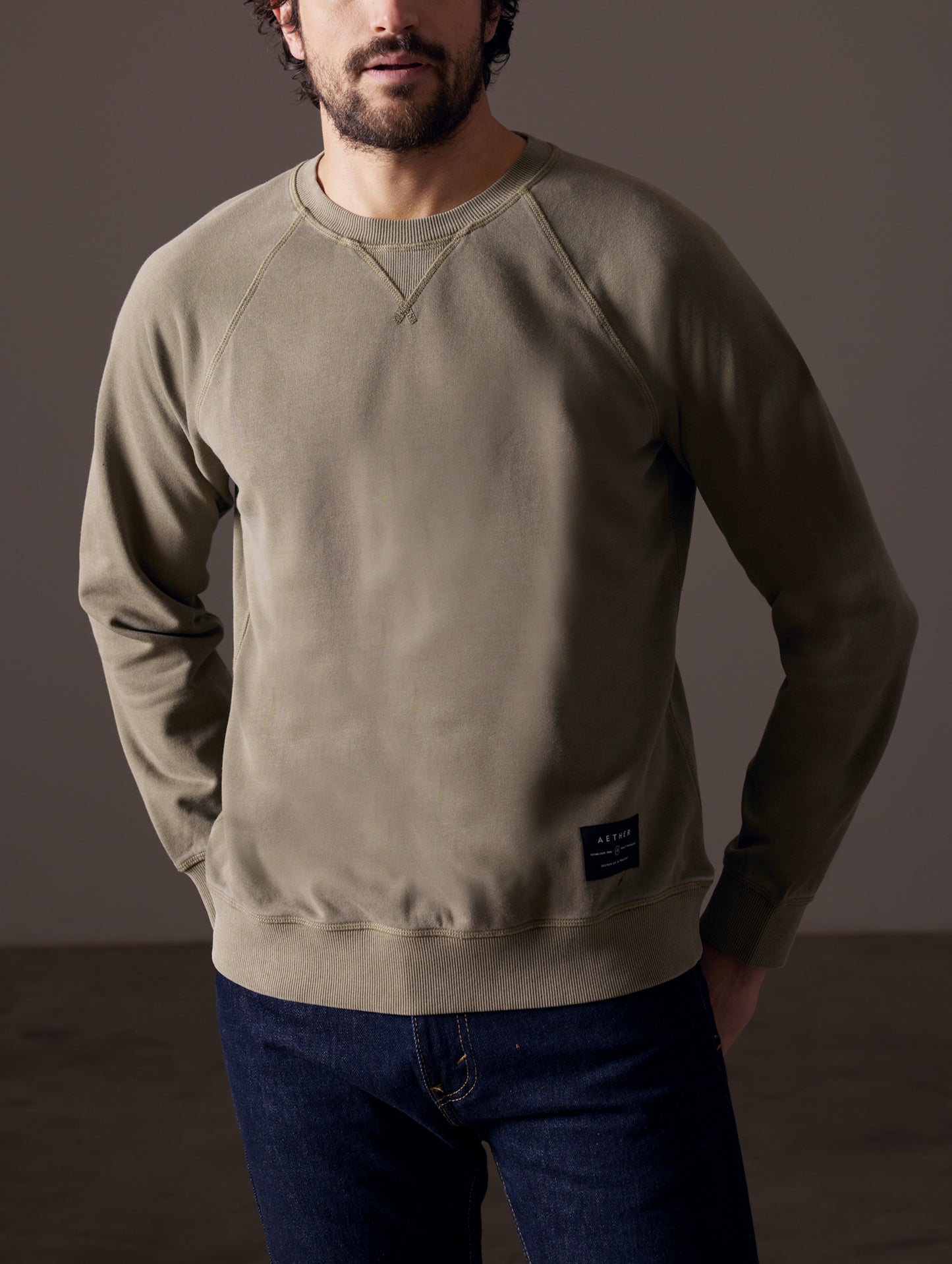 Front body view of man wearing Solstice Lightweight Crew in Command Green from AETHER Apparel.