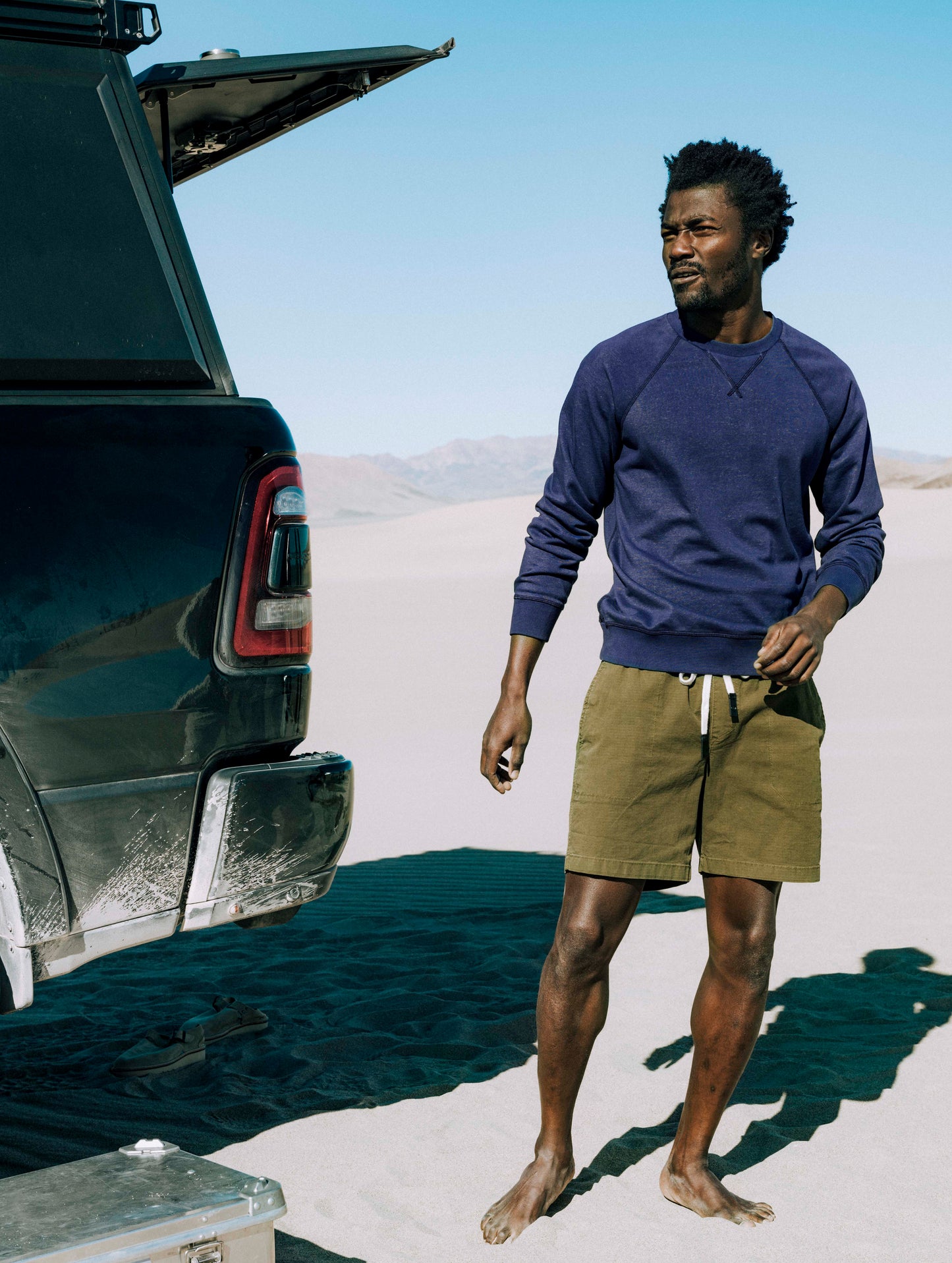 Man wearing blue crew sweatshirt