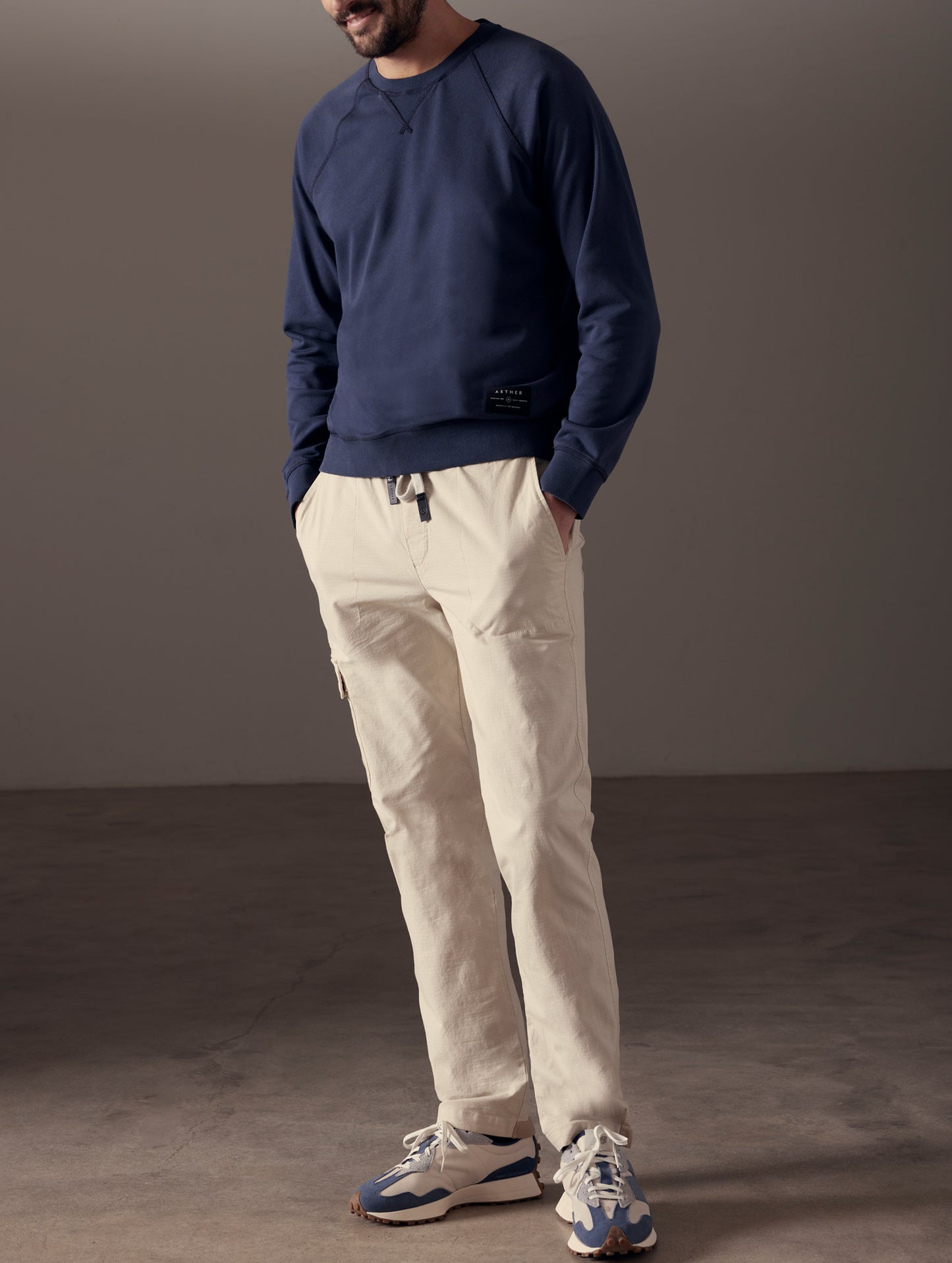 Man wearing blue crew sweatshirt