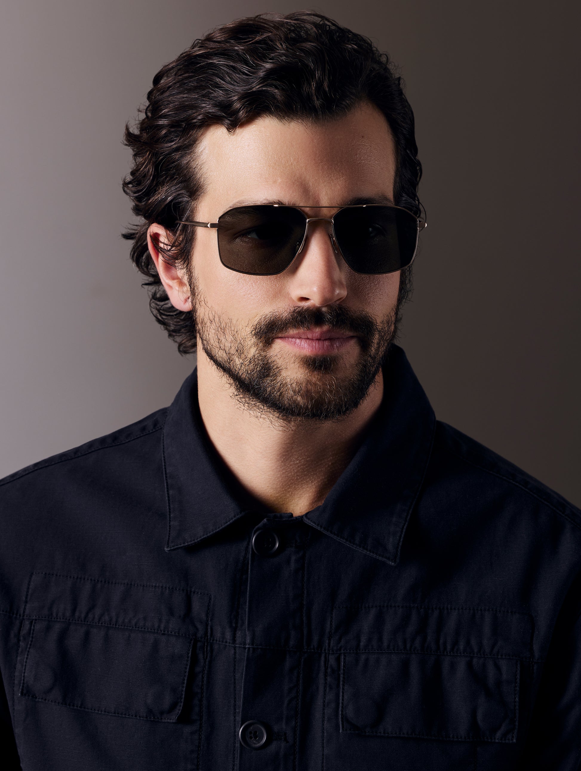 Front view of man wearing Arches Sunglass in Brushed Gold with Deep G15 Lens from AETHER Apparel.