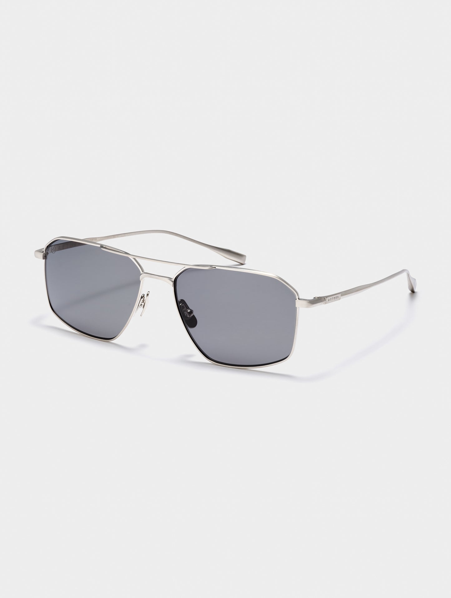 Front angled view of Arches Sunglass in Brushed Silver with Grey Lens from AETHER Apparel.