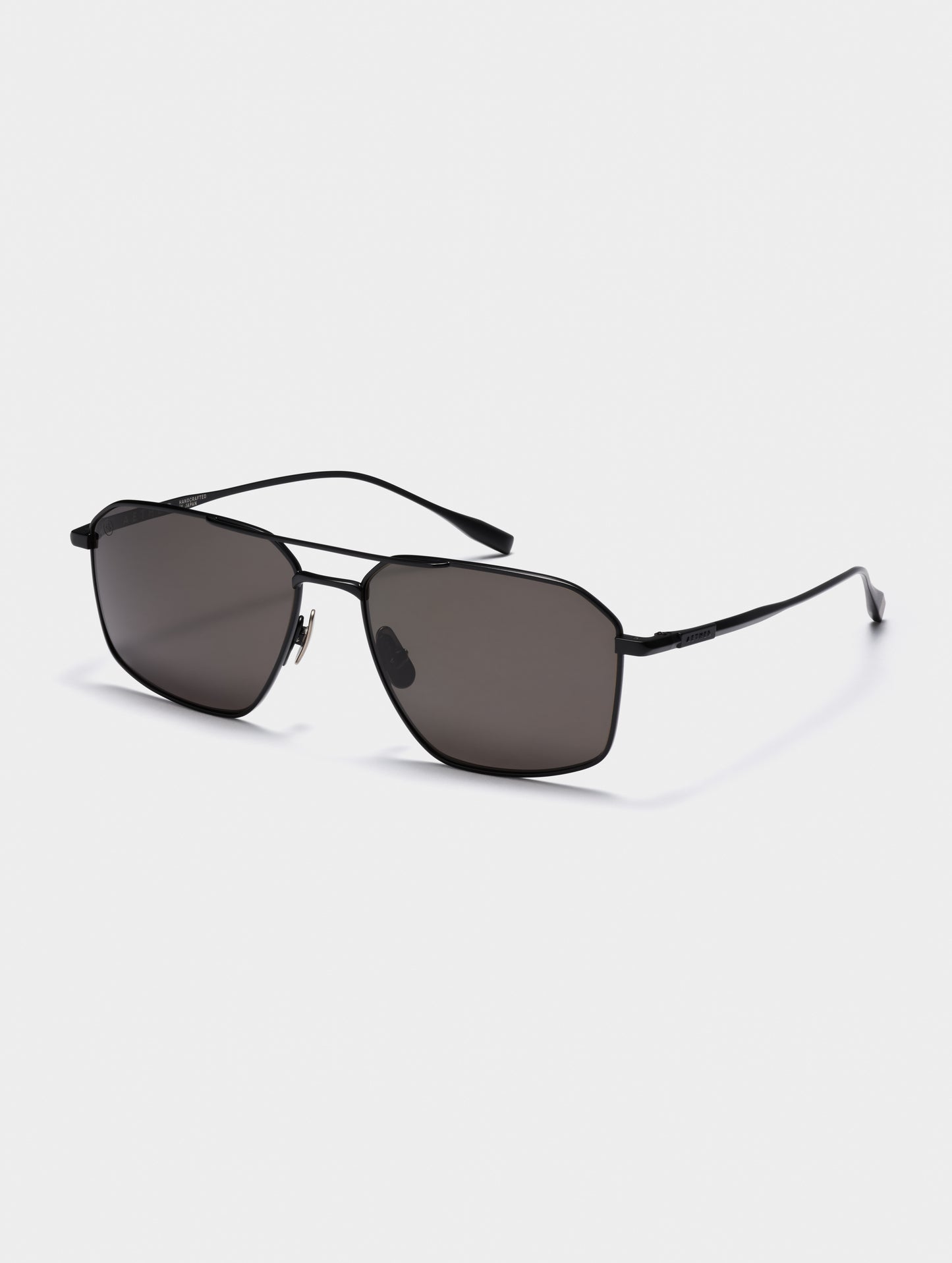 Front angled view of Arches Sunglass in Black with Black Lens from AETHER Apparel.