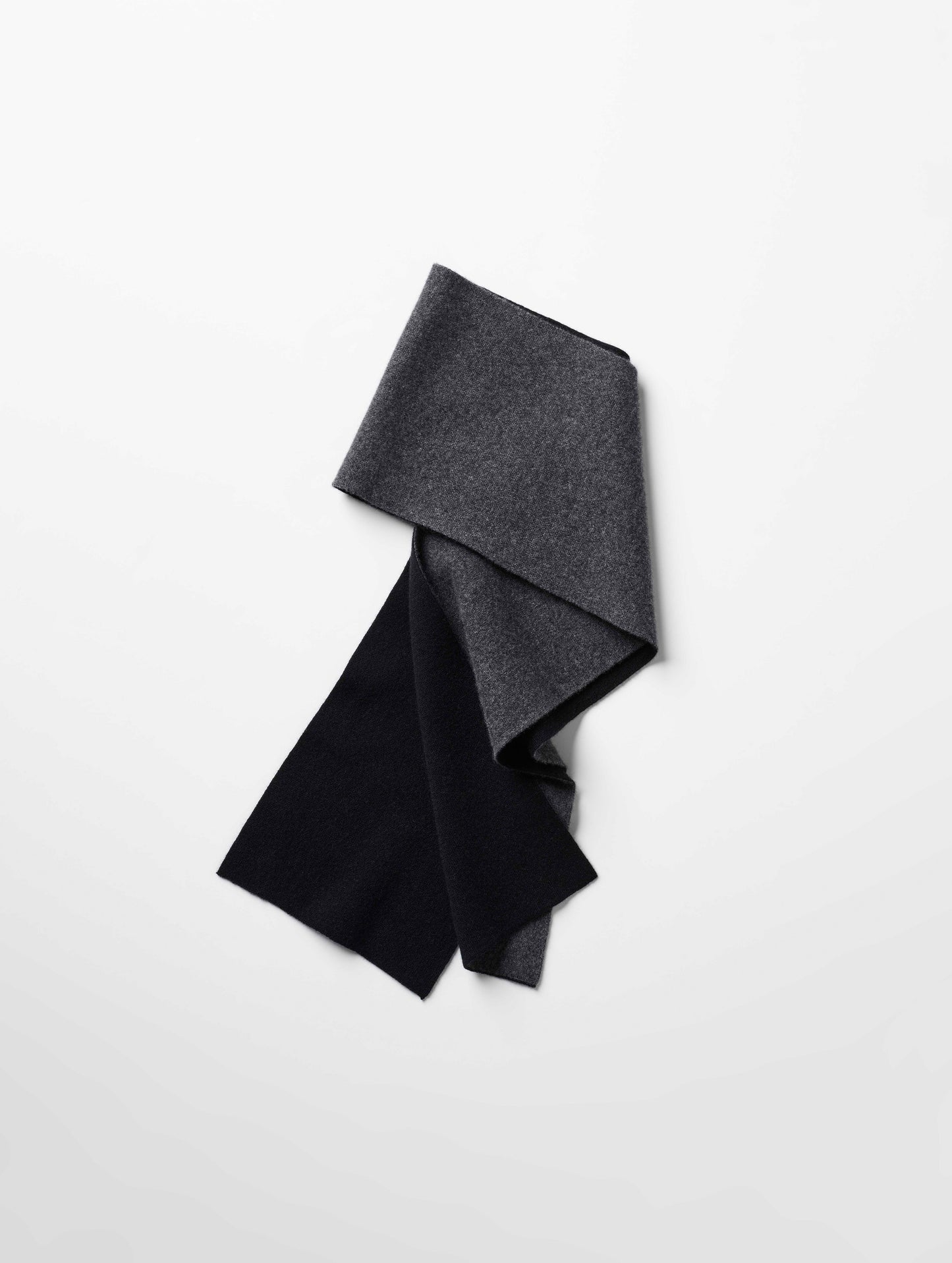 Flat lay of Avesta Cashmere Scarf in Onyx Black from AETHER Apparel.