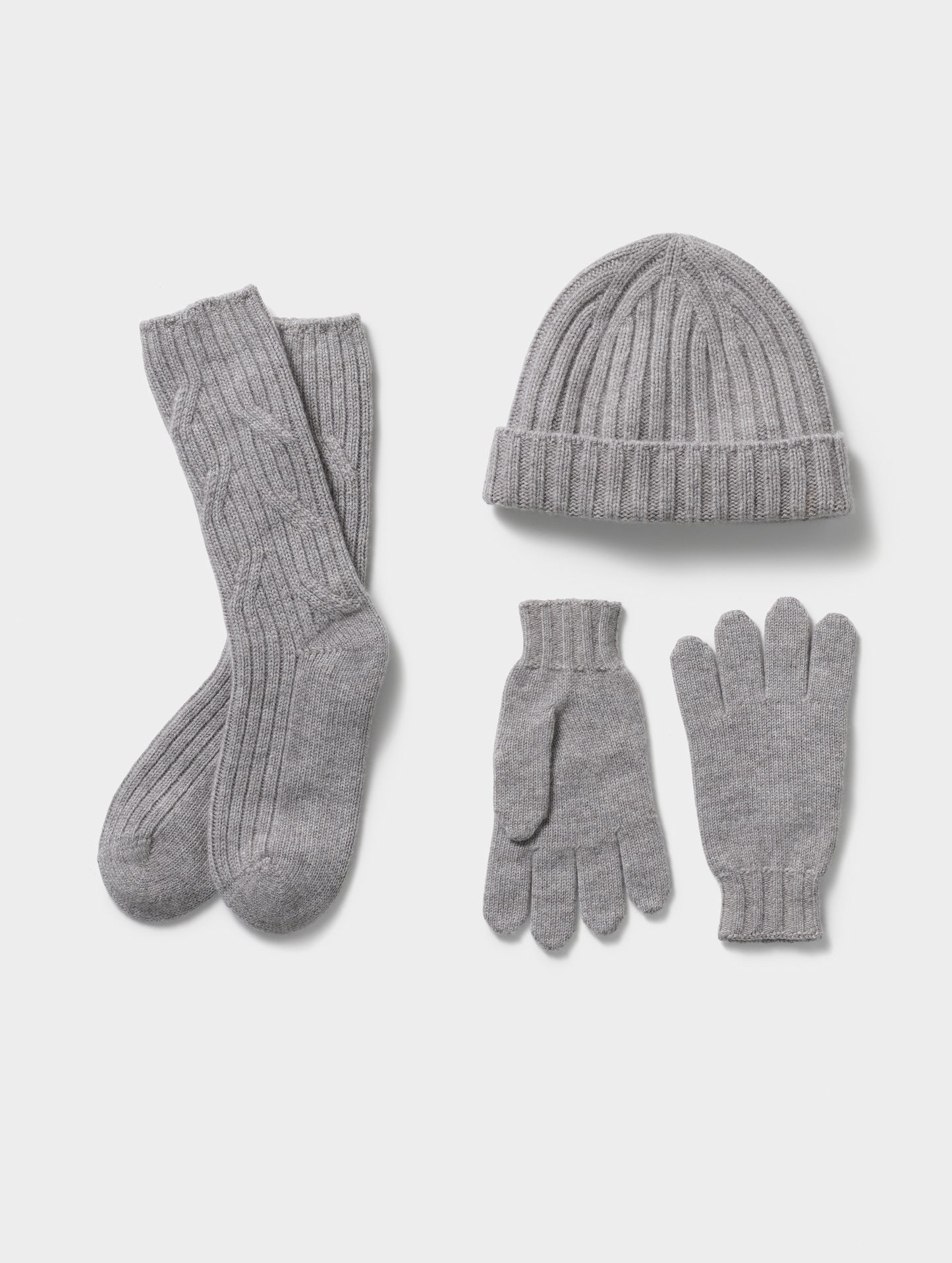 Flat lay of Cashmere Accessories Set in Light Heather Grey from AETHER Apparel.