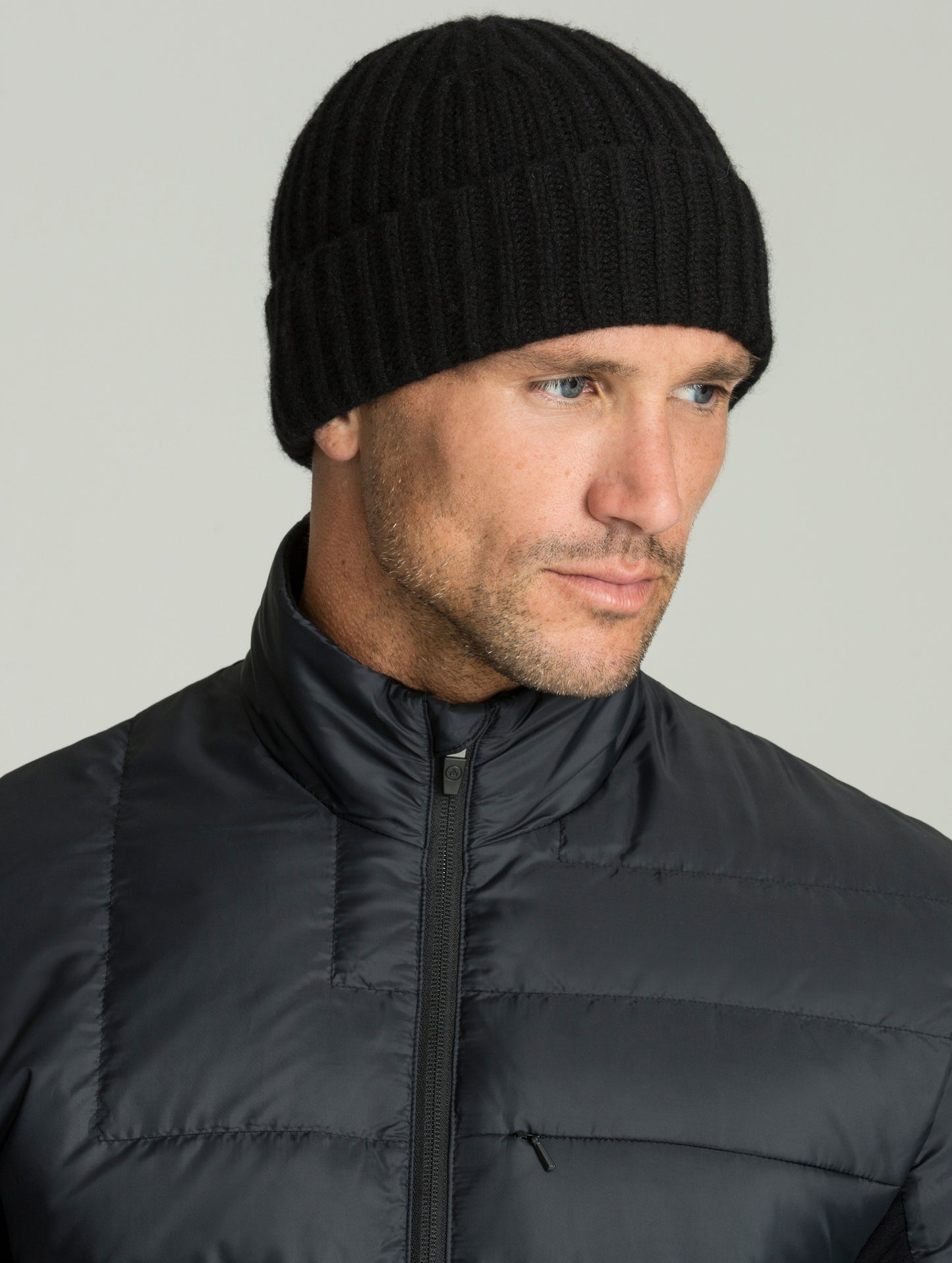 Front angled view of man wearing Cashmere Hat in Jet Black from AETHER Apparel.