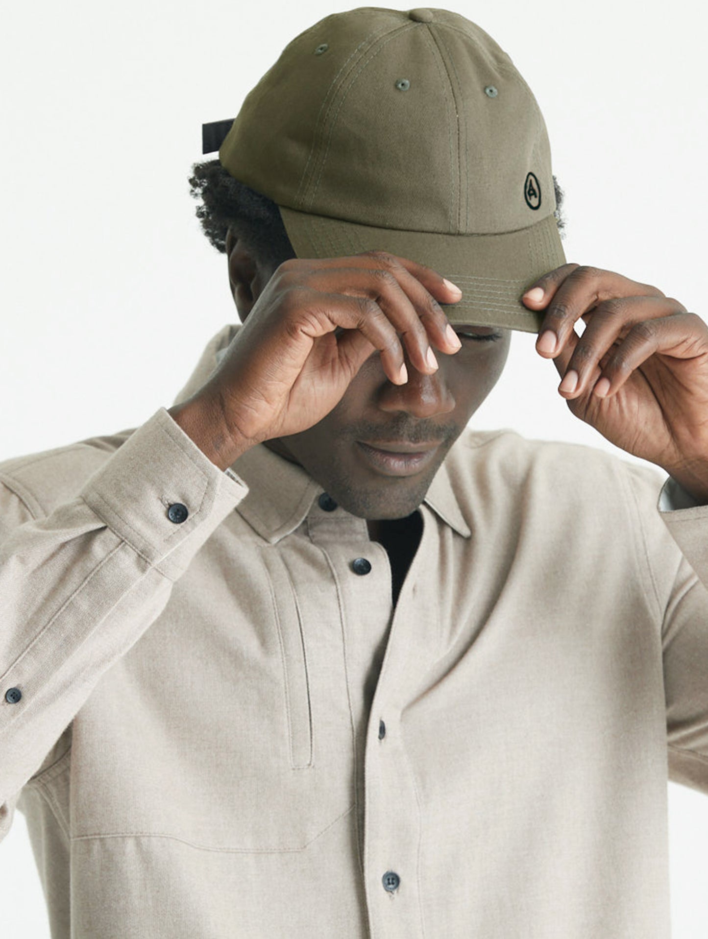 Man wearing green Cotton Ripstop Hat from AETHER Apparel.