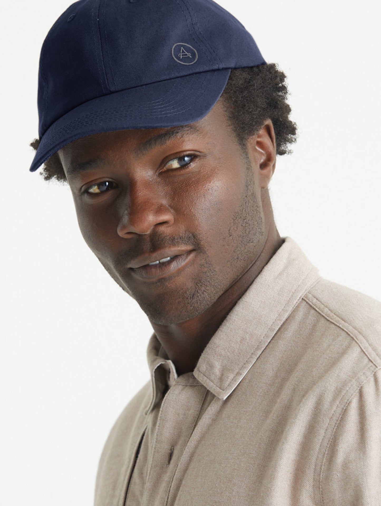 Man wearing blue Cotton Ripstop Hat from AETHER Apparel.