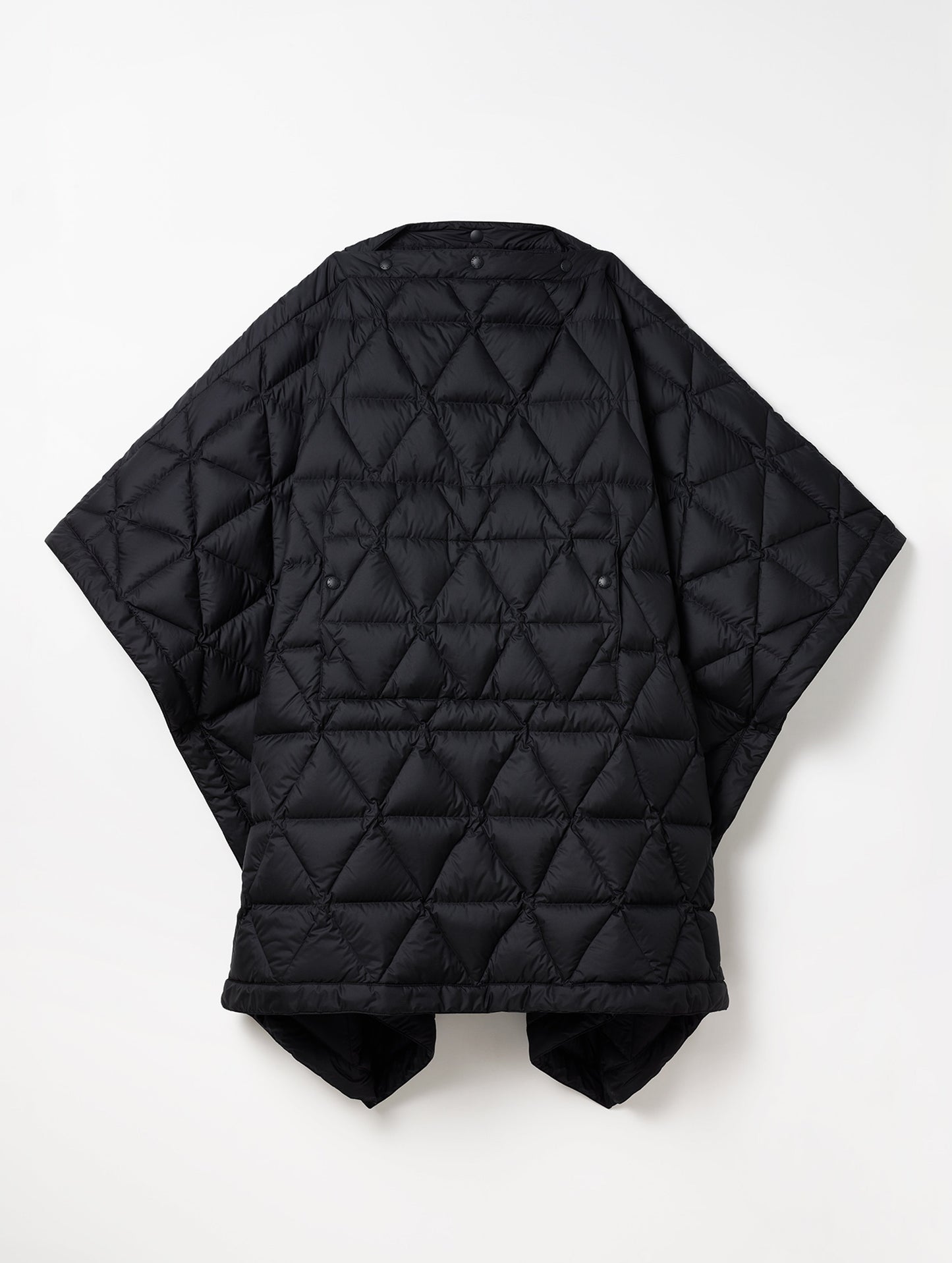 Flay lay image of Down Poncho in Onyx Black from AETHER Apparel.