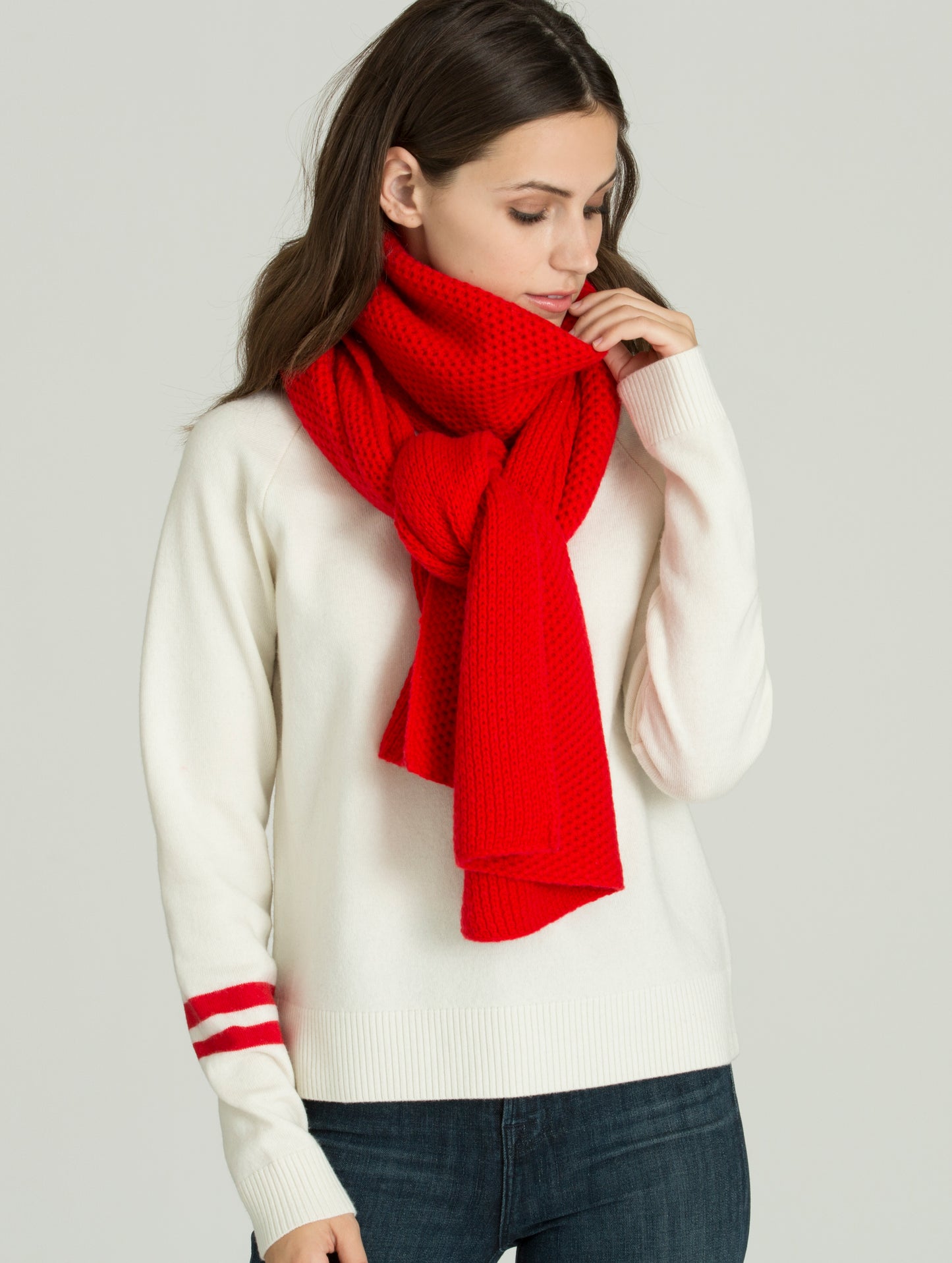 Woman wearing red Luxe Scarf from AETHER Apparel.