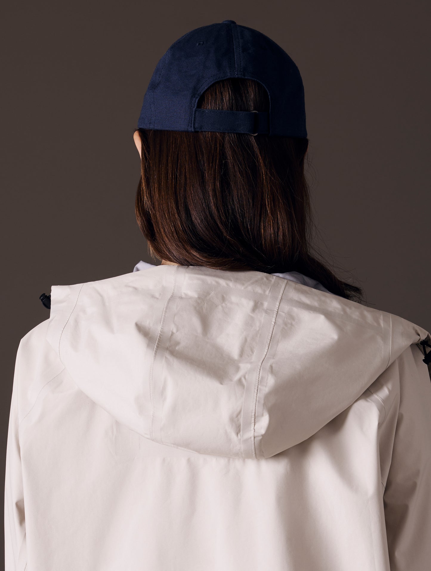Rear view of woman wearing AETHER Mountain Hat in Nordic Navy blue from AETHER Apparel.