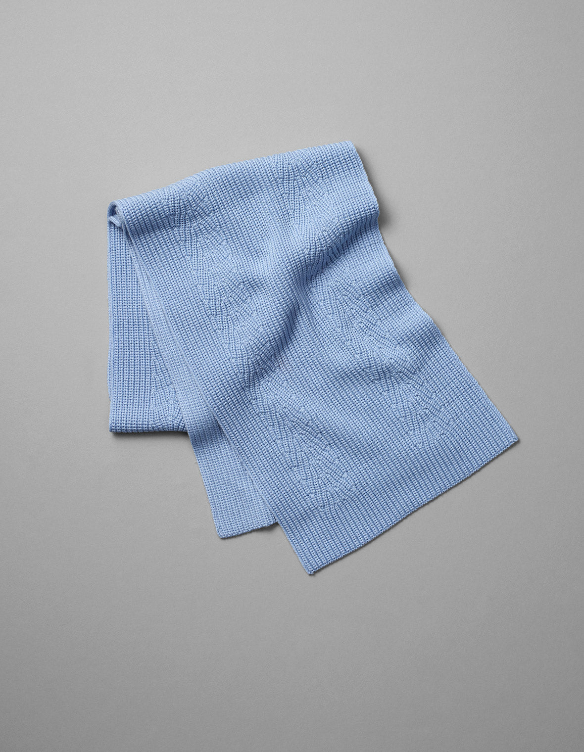 Folded light blue Peak Scarf from AETHER Apparel.
