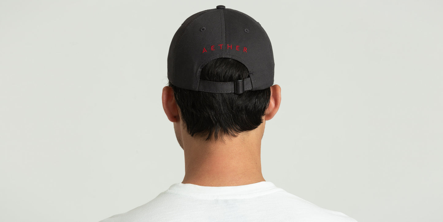 back view of man wearing dark grey hat from AETHER Apparel