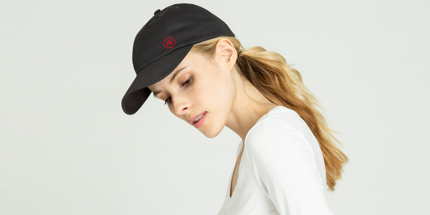 Front angled view of woman wearing Everyday Hat in Graphite from AETHER Apparel.