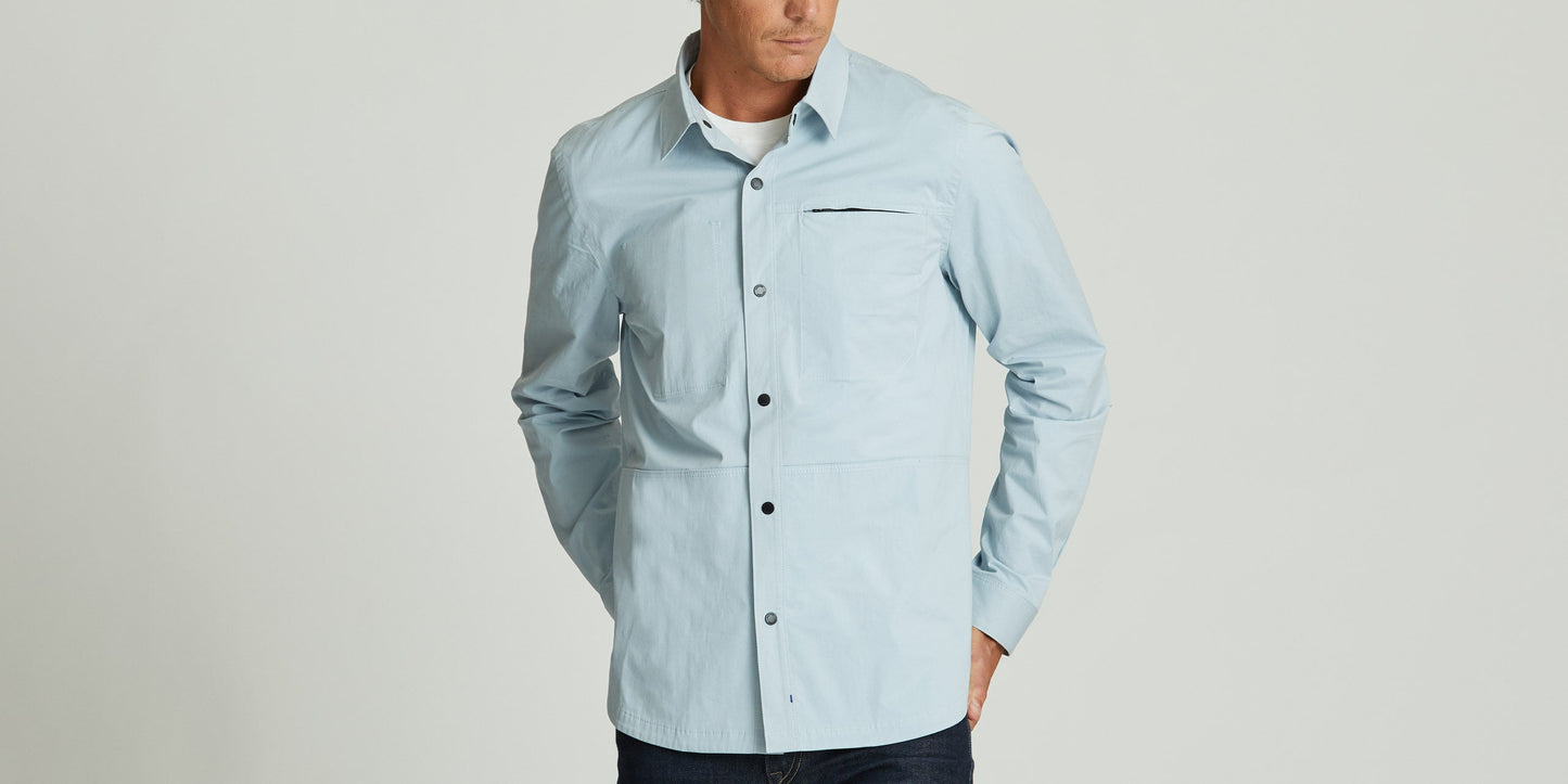 Man wearing light blue Hubble Jacket from AETHER Apparel.