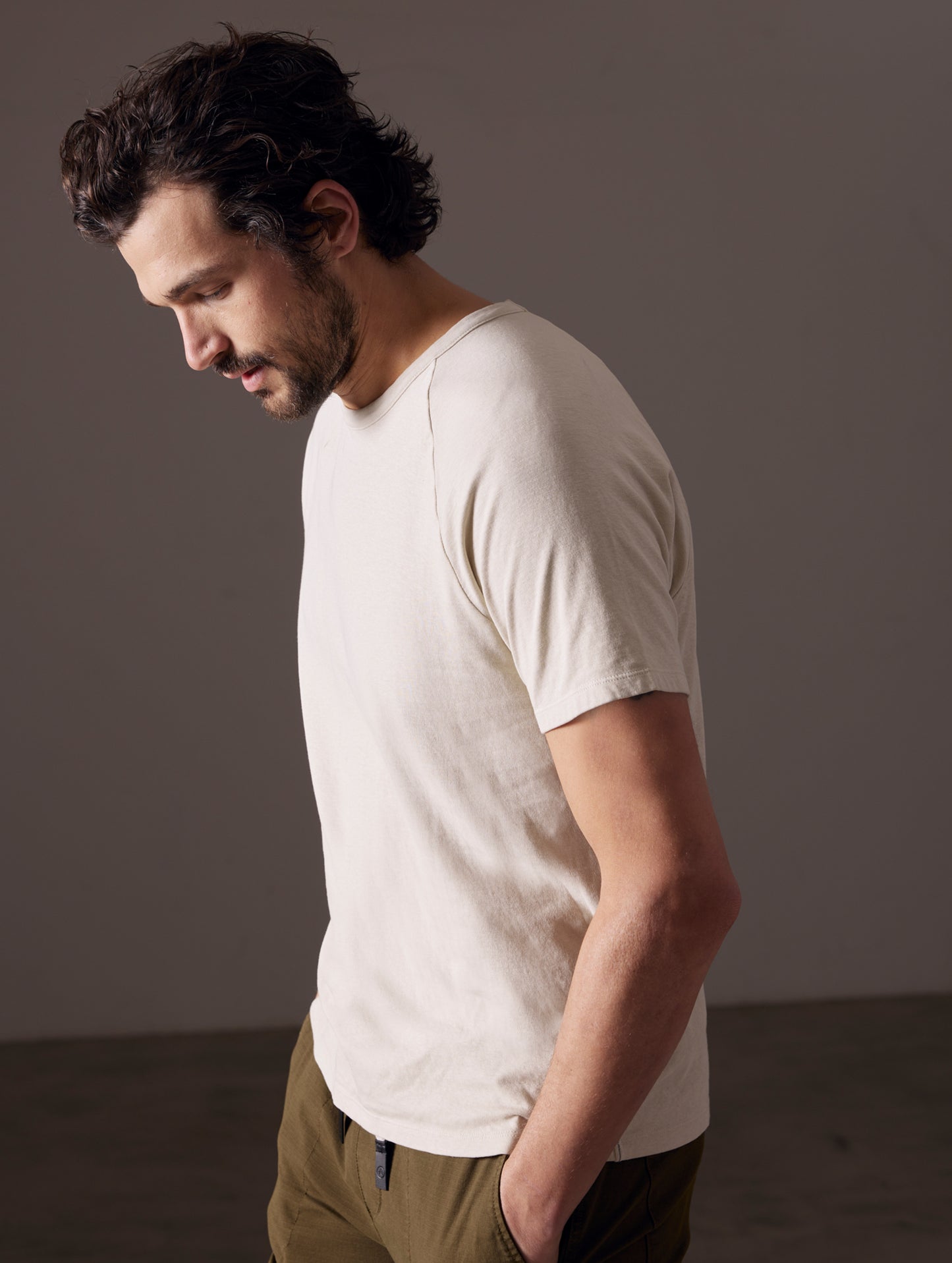 man wearing beige tee from AETHER Apparel