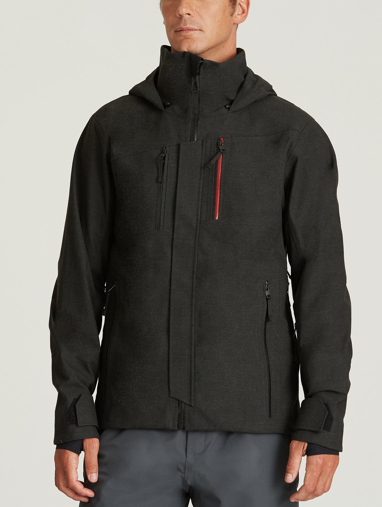 Front body view of man wearing Catalyst Snow Shell in Charcoal Dark Heather from AETHER Apparel.
