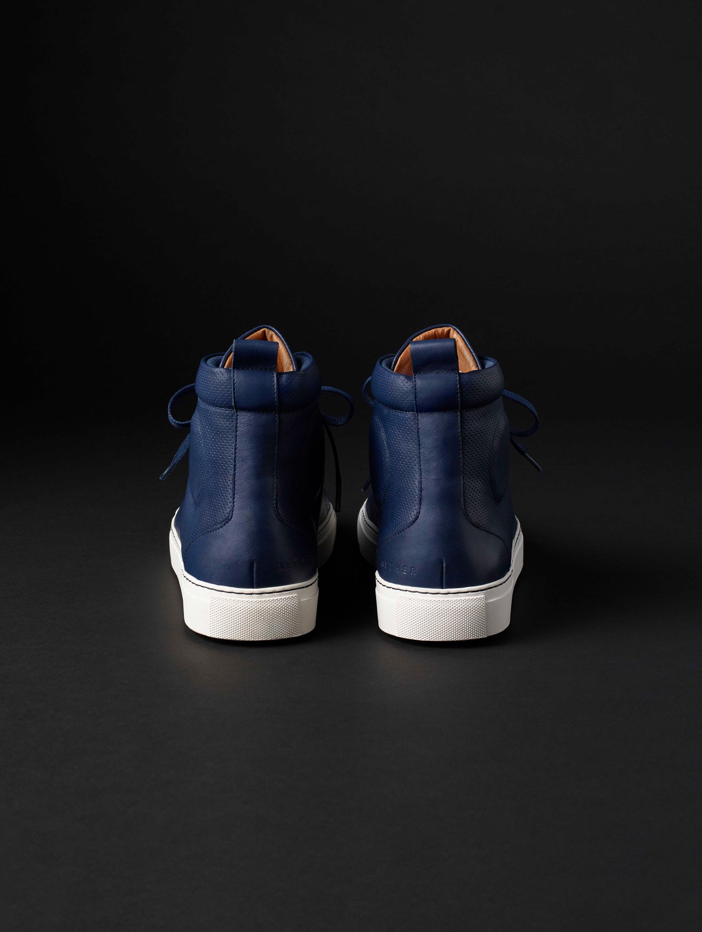 Rear view of men’s Dalton Sneaker in Nordic Navy blue from AETHER Apparel.
