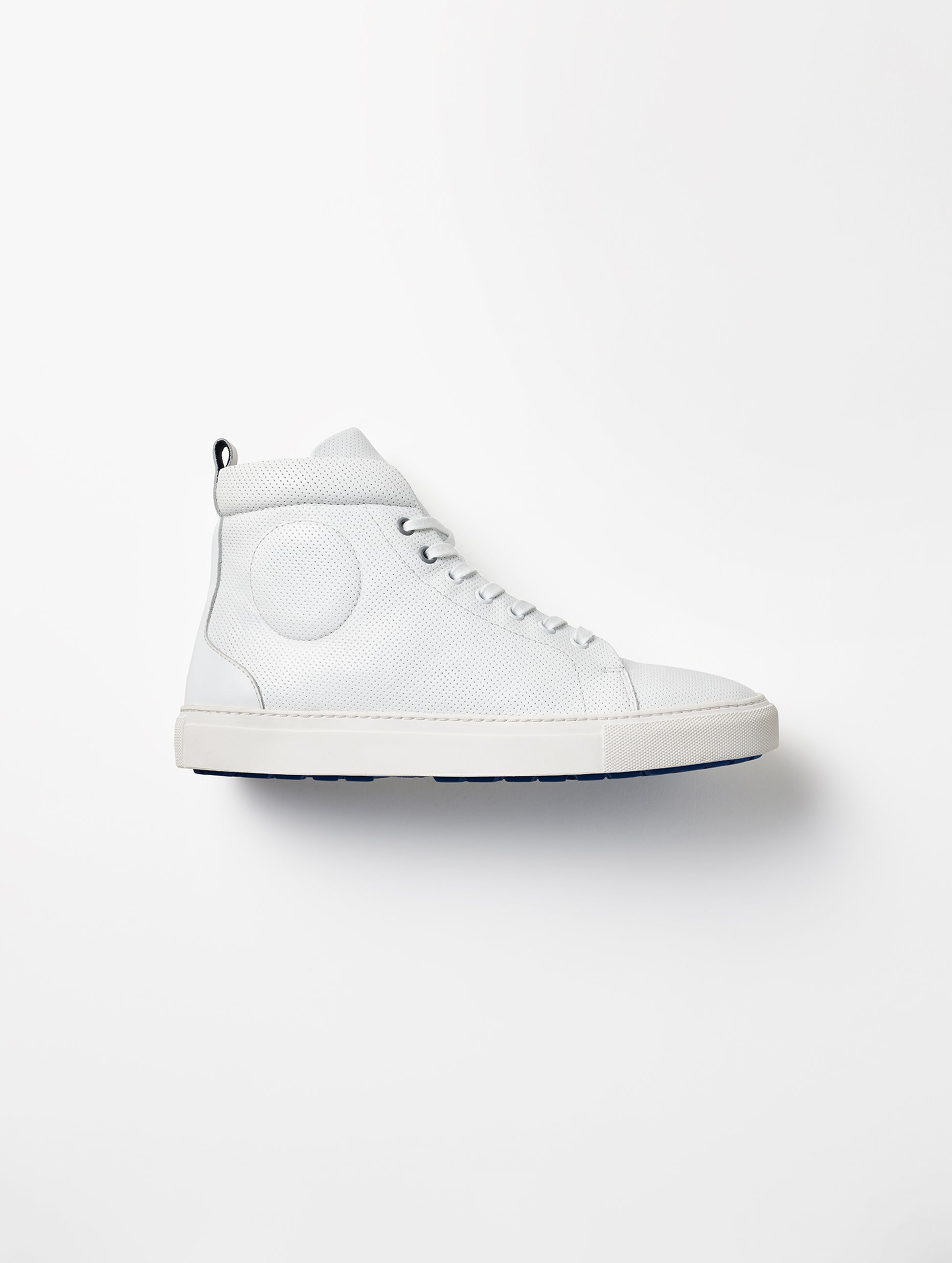 Side profile view of individual men's Dalton Sneaker in White from AETHER Apparel.