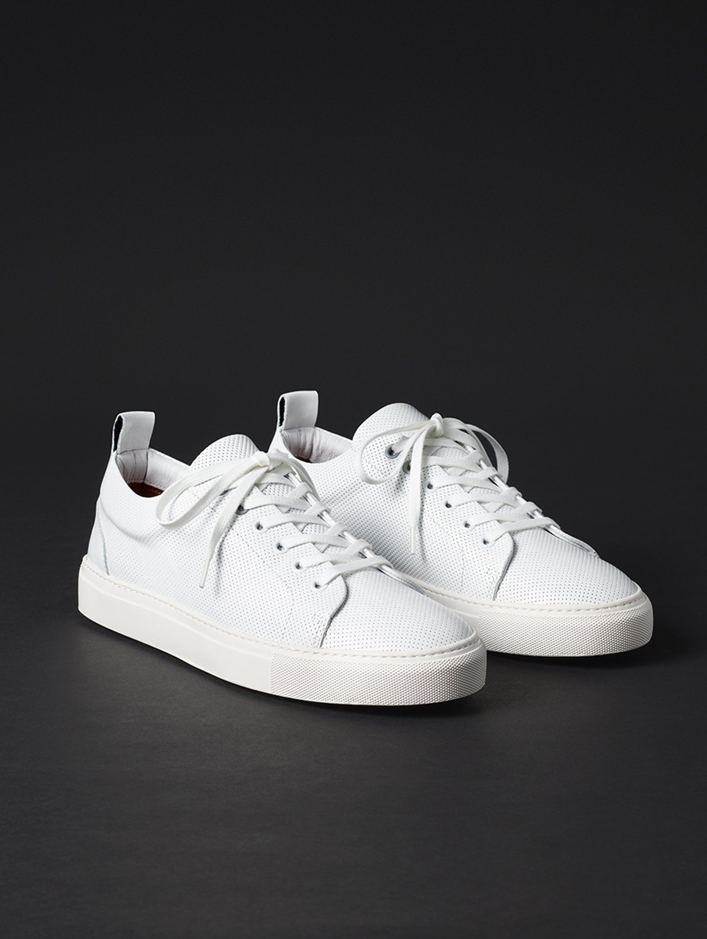 Front angled view of men’s Dalton Low-Top Sneaker in White from AETHER Apparel.