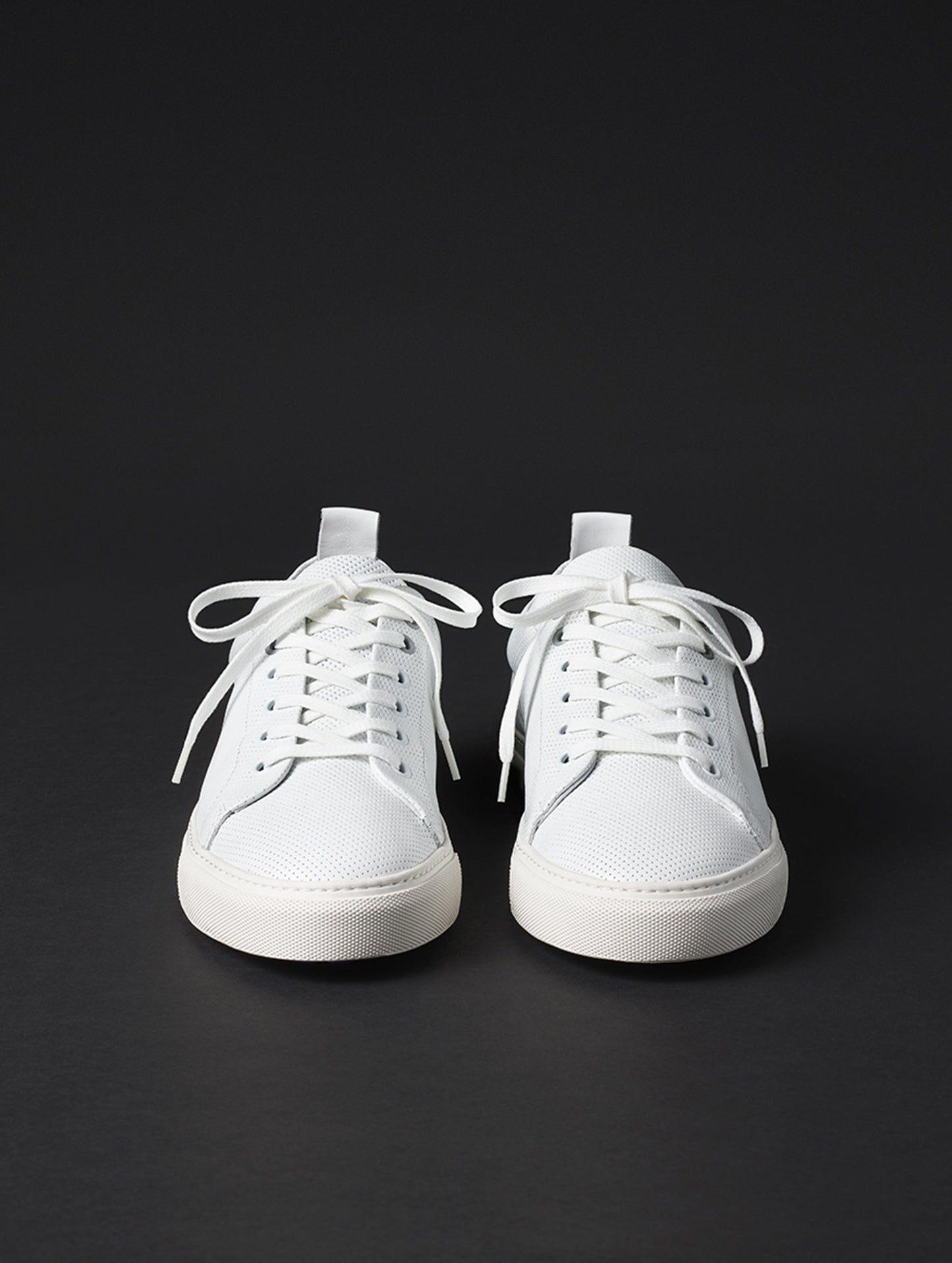 Front view of men’s Dalton Low-Top Sneaker in White from AETHER Apparel.