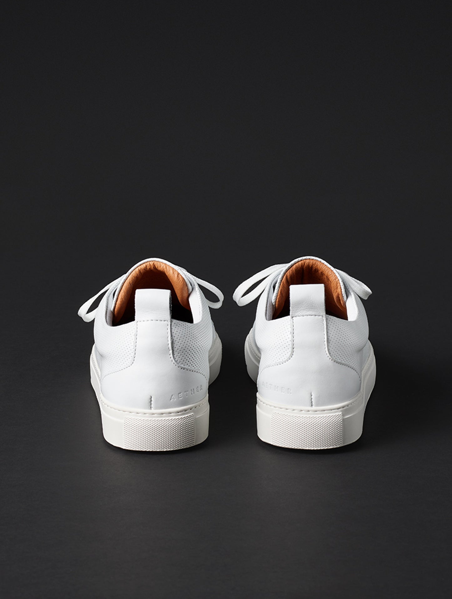 Rear view of men’s Dalton Low-Top Sneaker in White from AETHER Apparel.