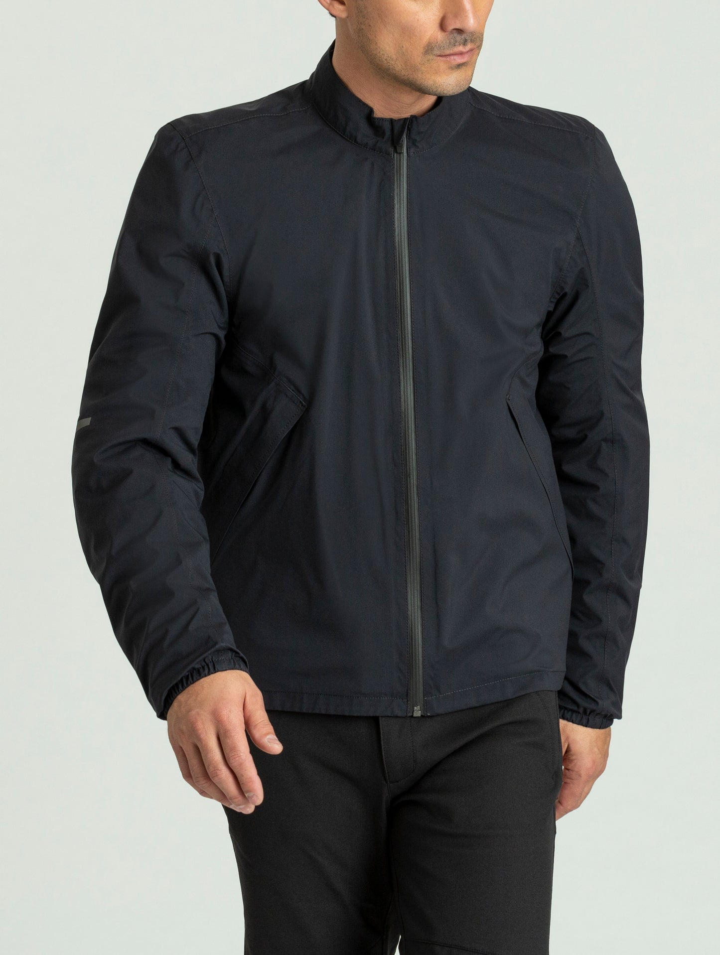 Front 3/4 body view of man wearing Draft Mesh Motorcycle Jacket in Jet Black from AETHER Apparel.