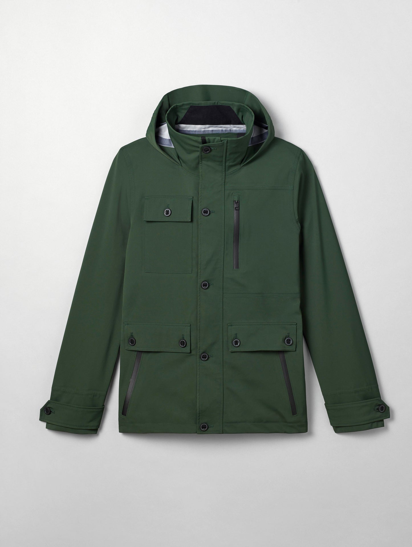 Flat lay of men's Endeavor Jacket in Duffle Green from AETHER Apparel.