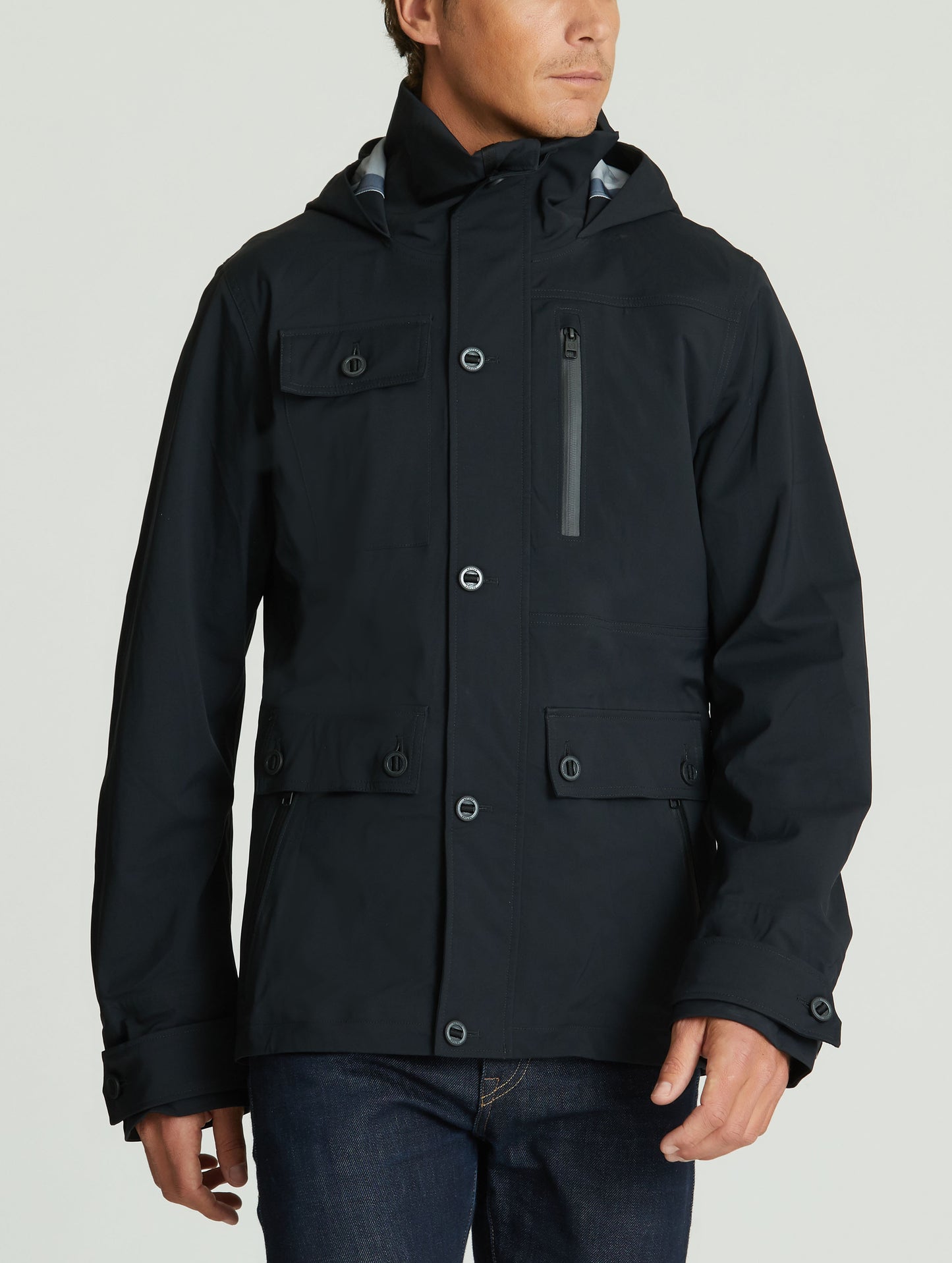Front body view of man wearing Endeavor Jacket in Onyx Black from AETHER Apparel.