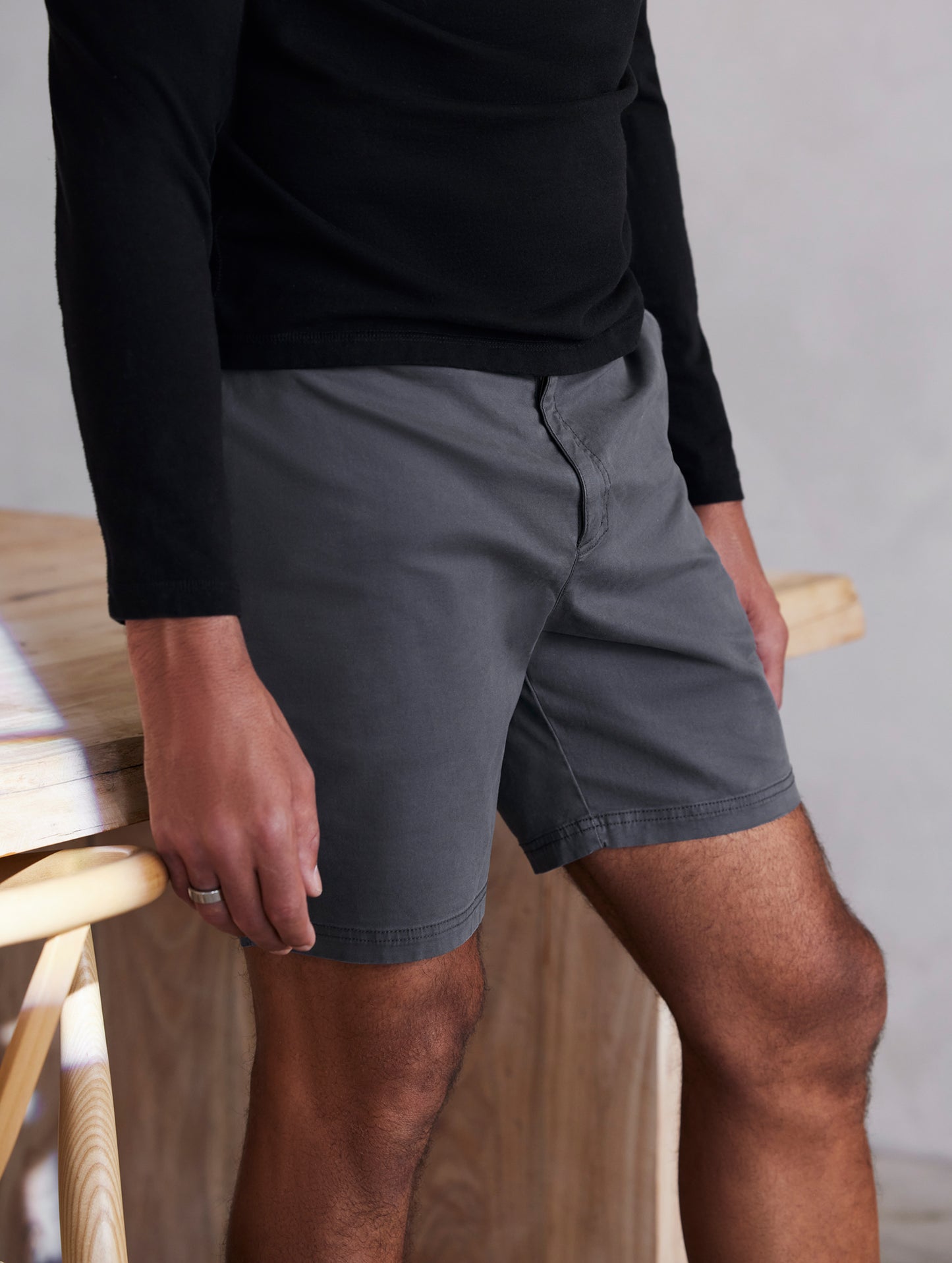 Front angled lower body view of man wearing Fairfax Short 7½" in Graphite from AETHER Apparel.