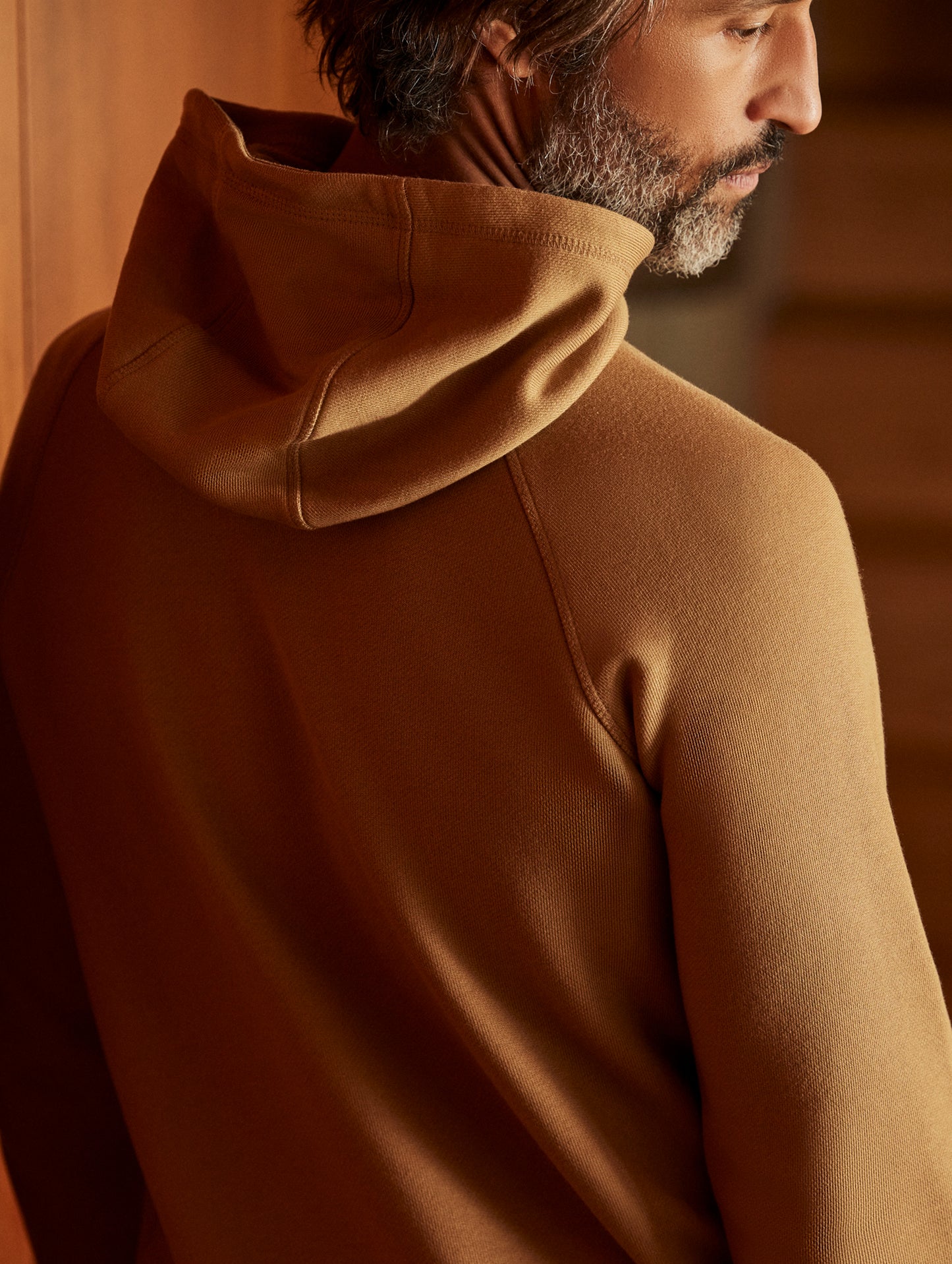 man wearing a brown hoodie