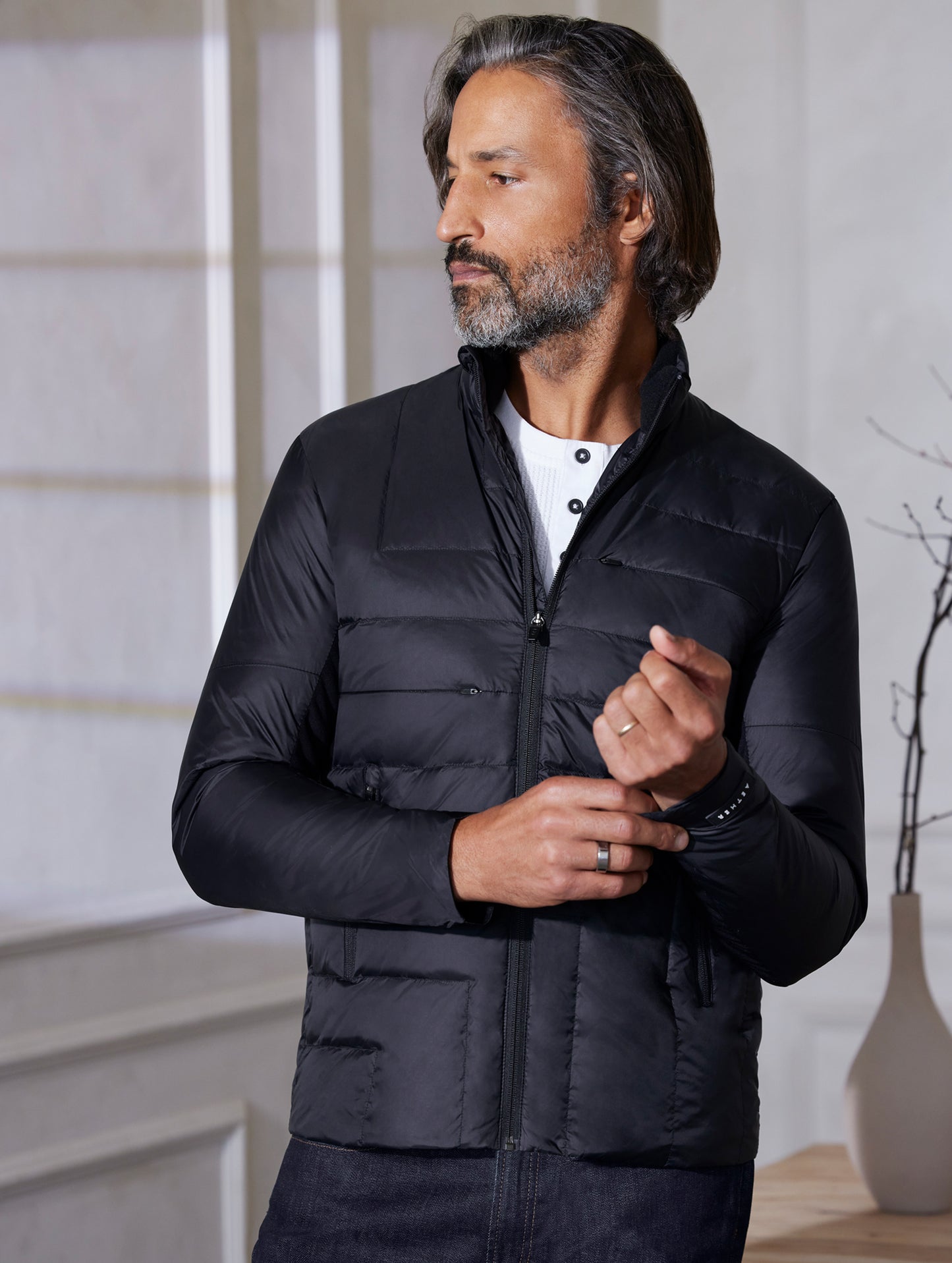 man wearing quilted black jacket